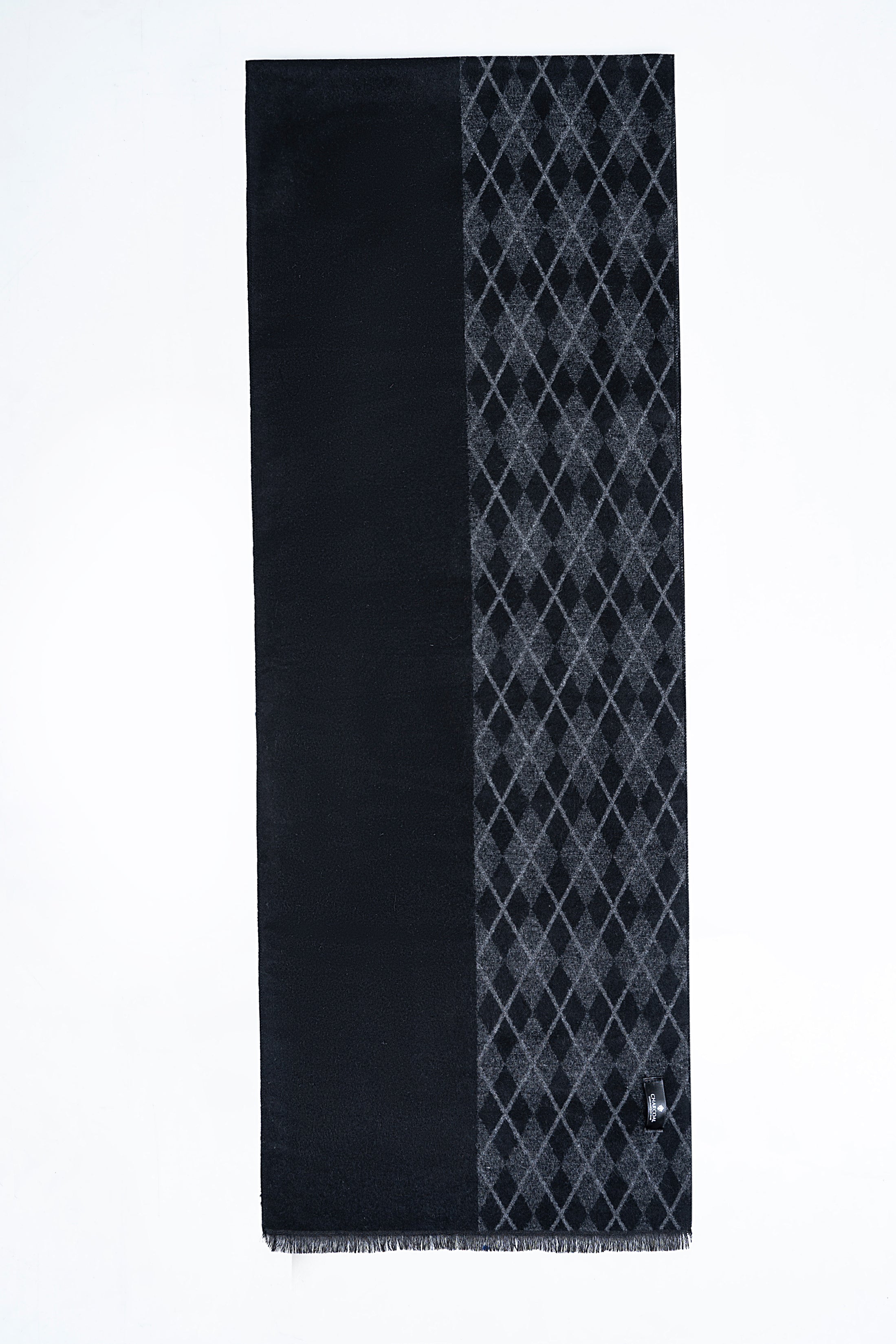 Dark scarf with diagonal diamond pattern and solid side panel, fringed edges