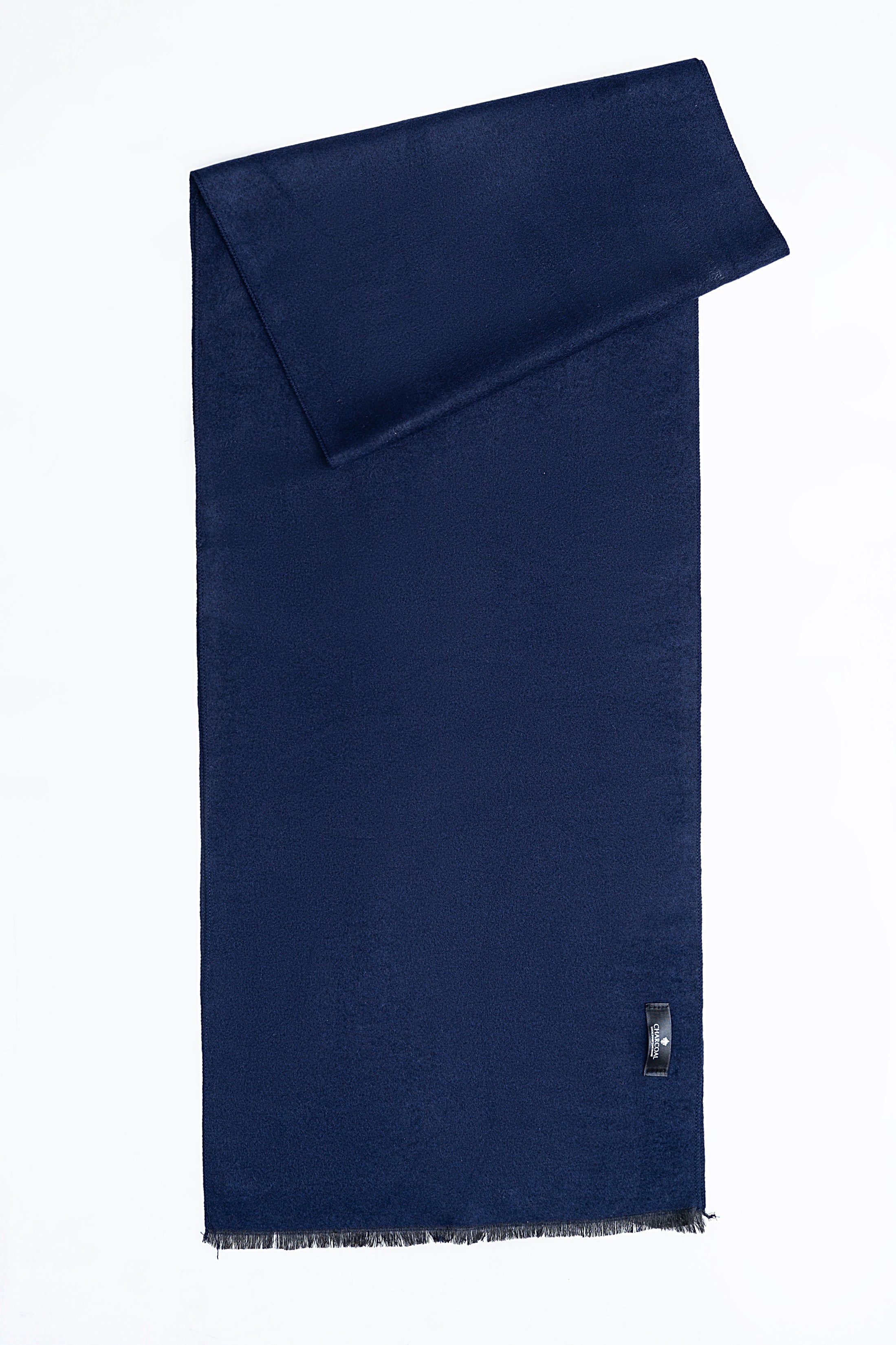 Navy blue scarf with folded end and fine fringe hem, small metal brand tab