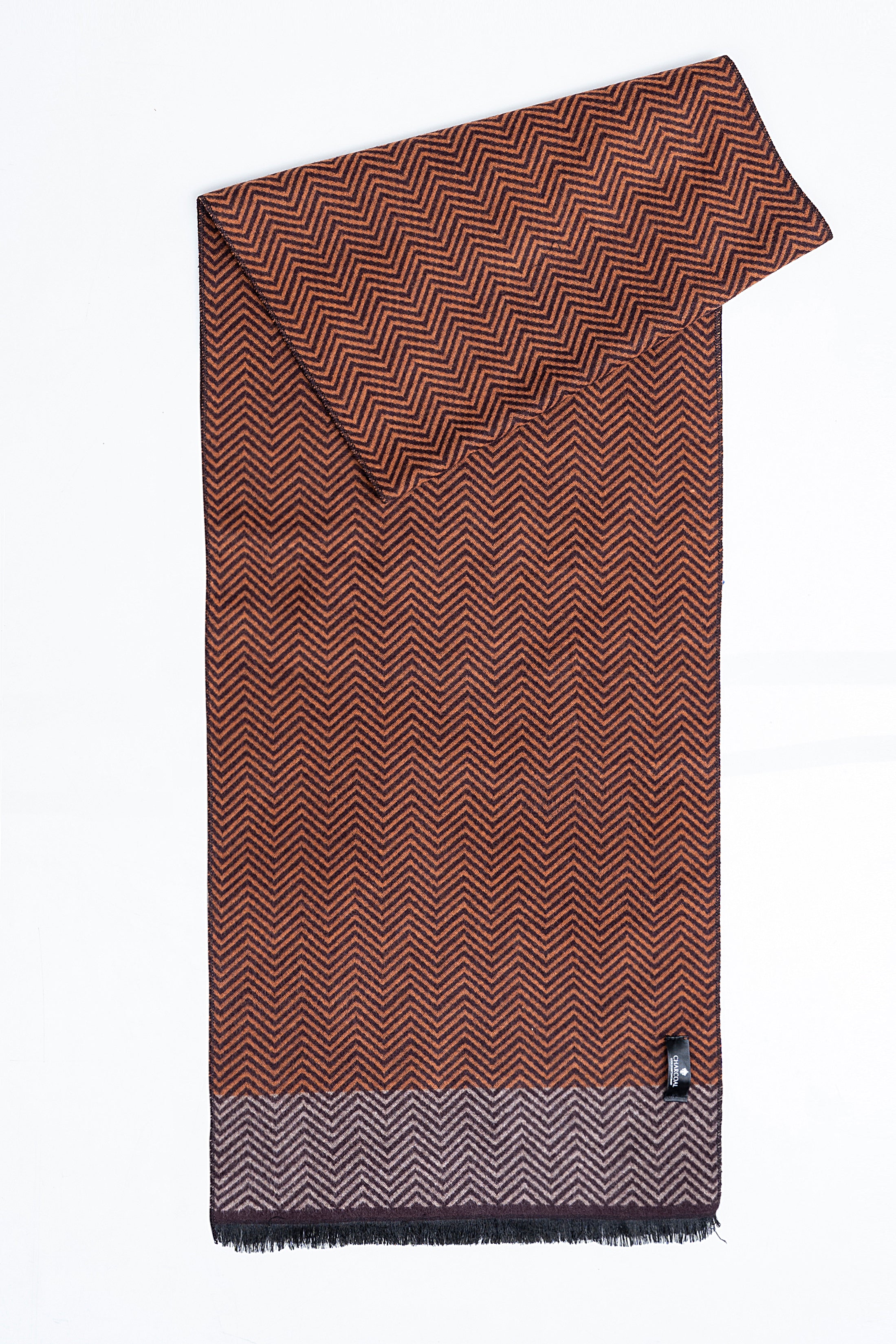 Chevron scarf, rust brown with dark zigzags, corner tag and fringed hem