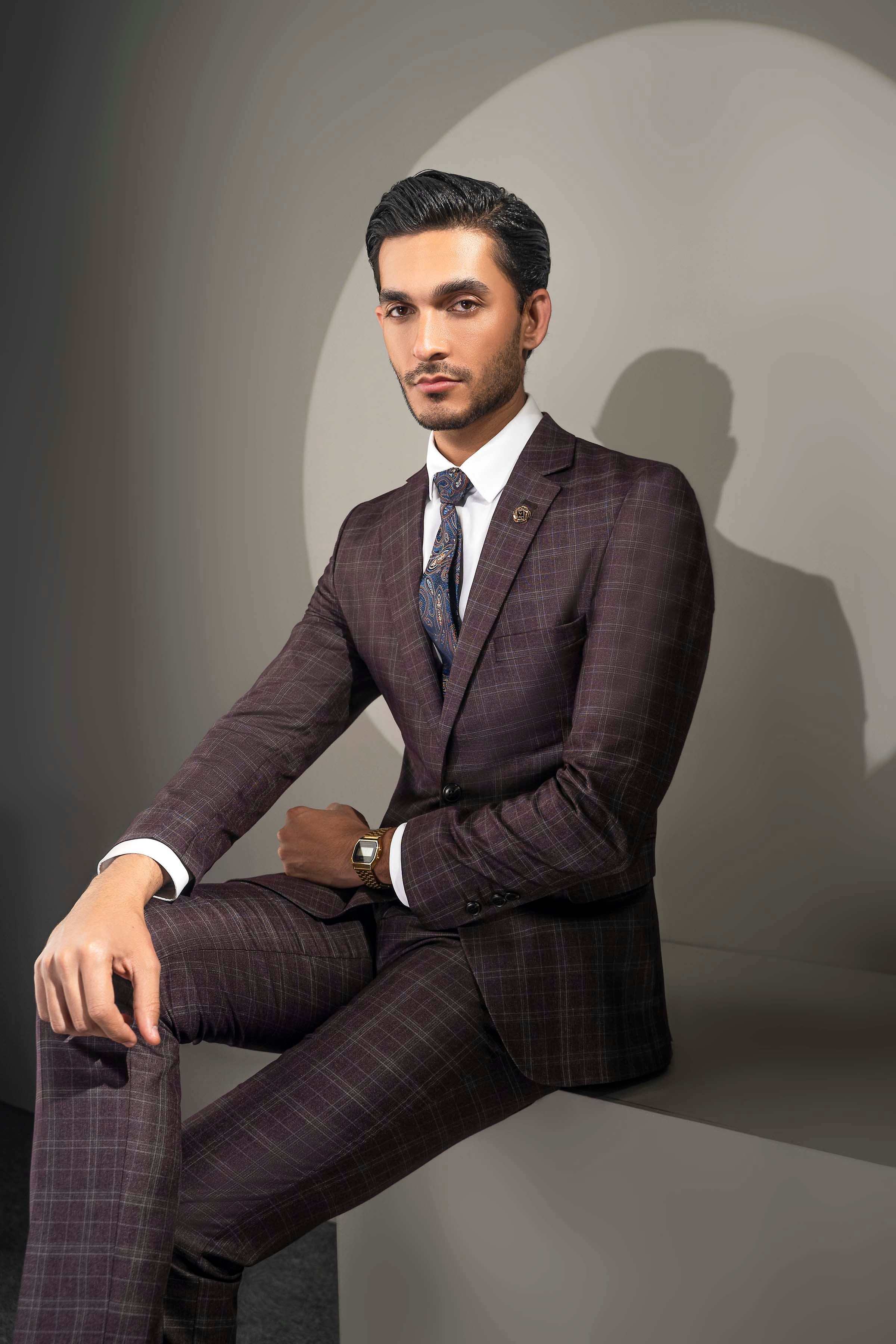 Men's 2-piece suit dark maroon plaid, seated pose showing jacket and matching trousers
