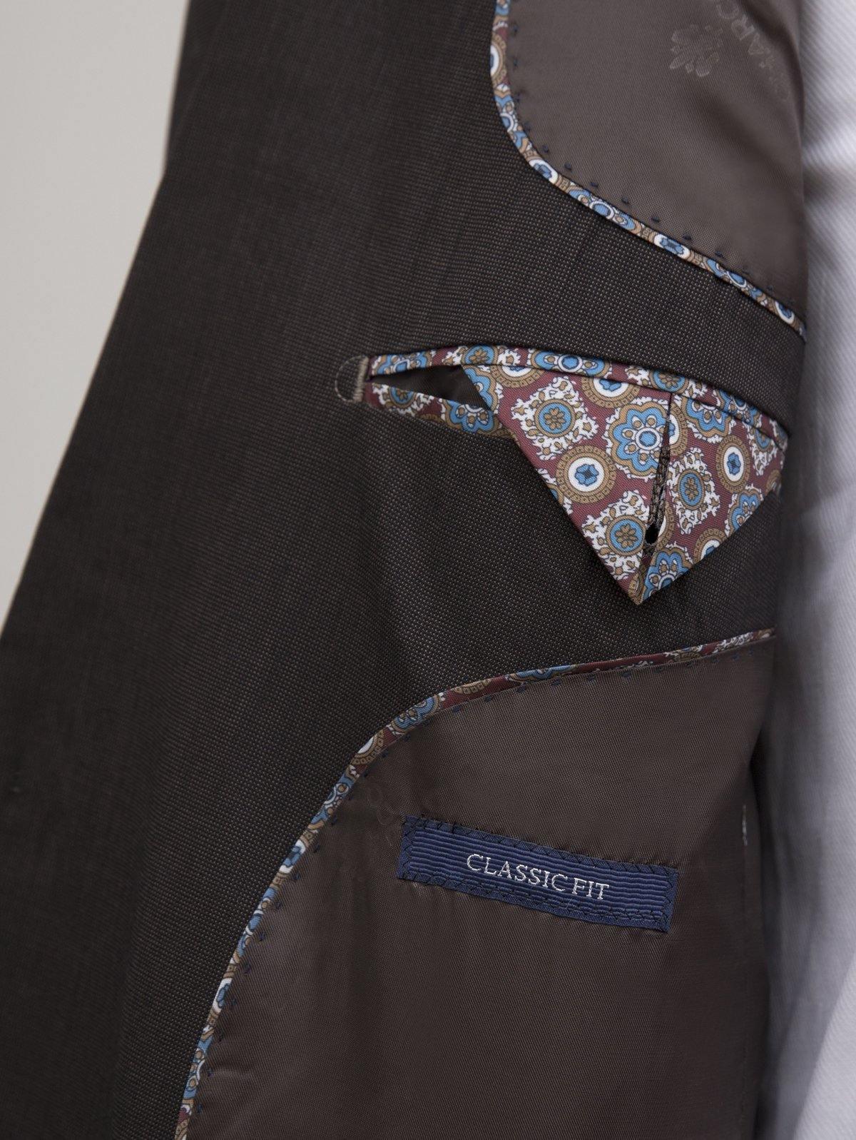 Men's suit jacket with patterned pocket trim and 'Classic Fit' interior label