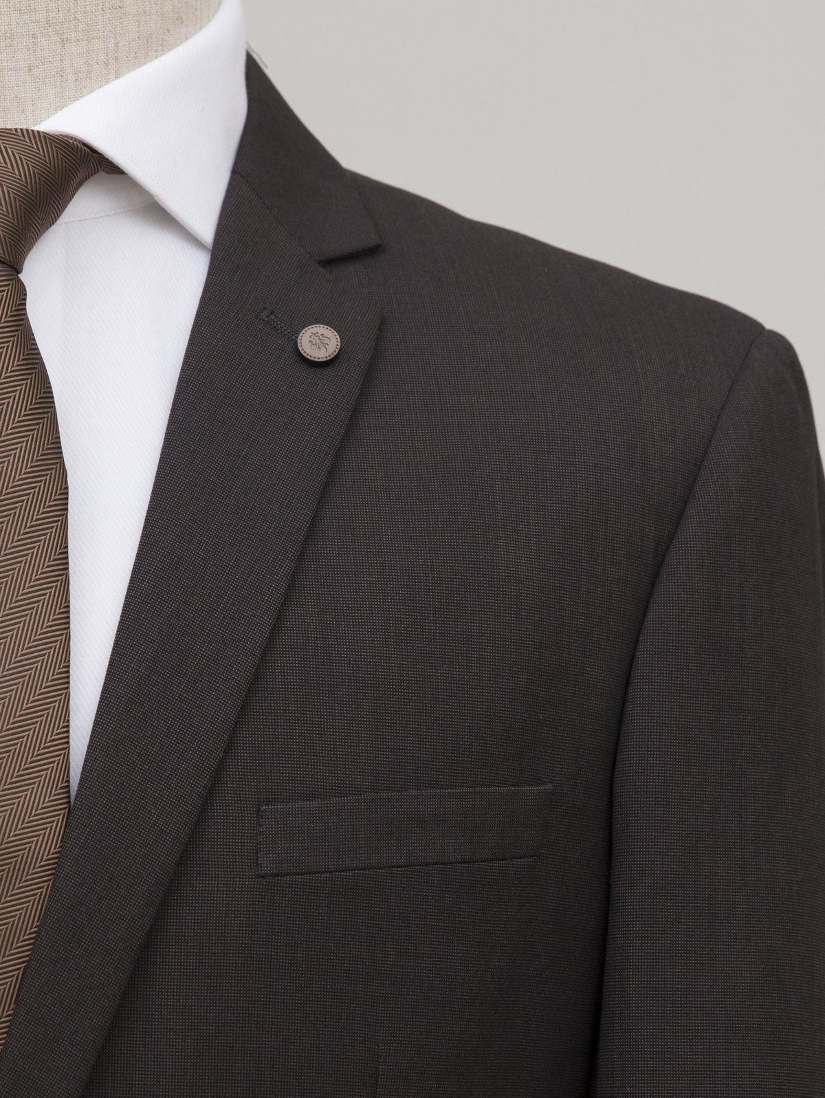 Men's suit jacket shoulder and lapel with round lapel pin and pocket flap
