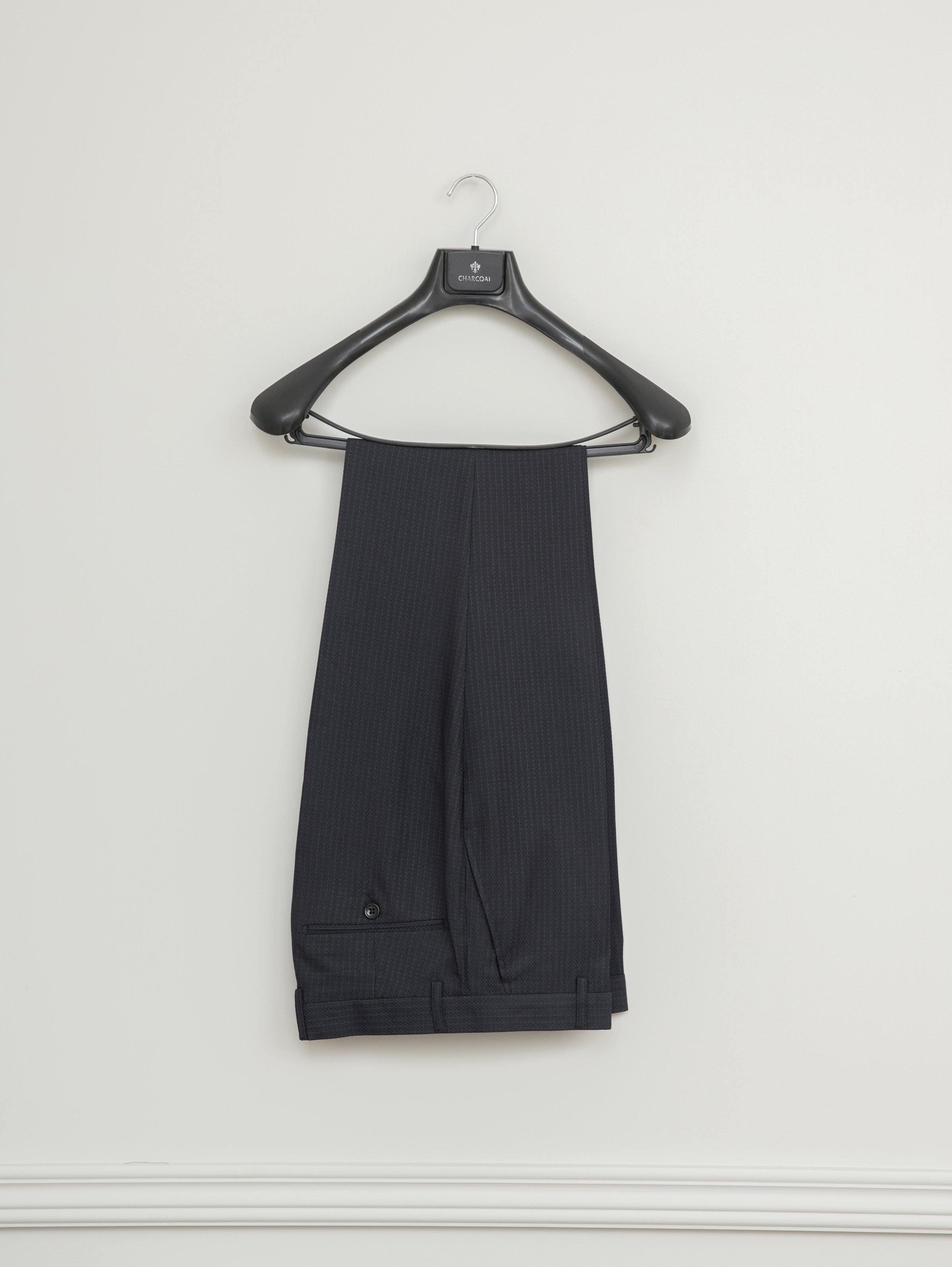 Dark suit trousers with subtle pinstripe texture