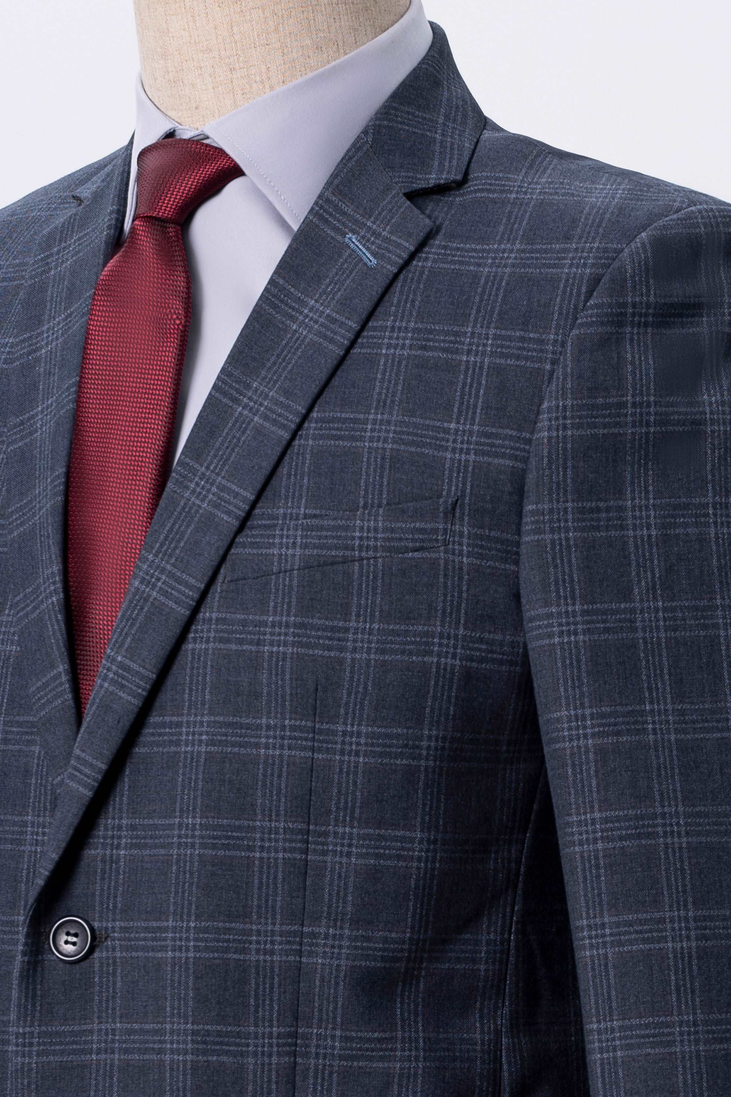 Blue-gray plaid suit jacket detail with notched lapel and chest pocket