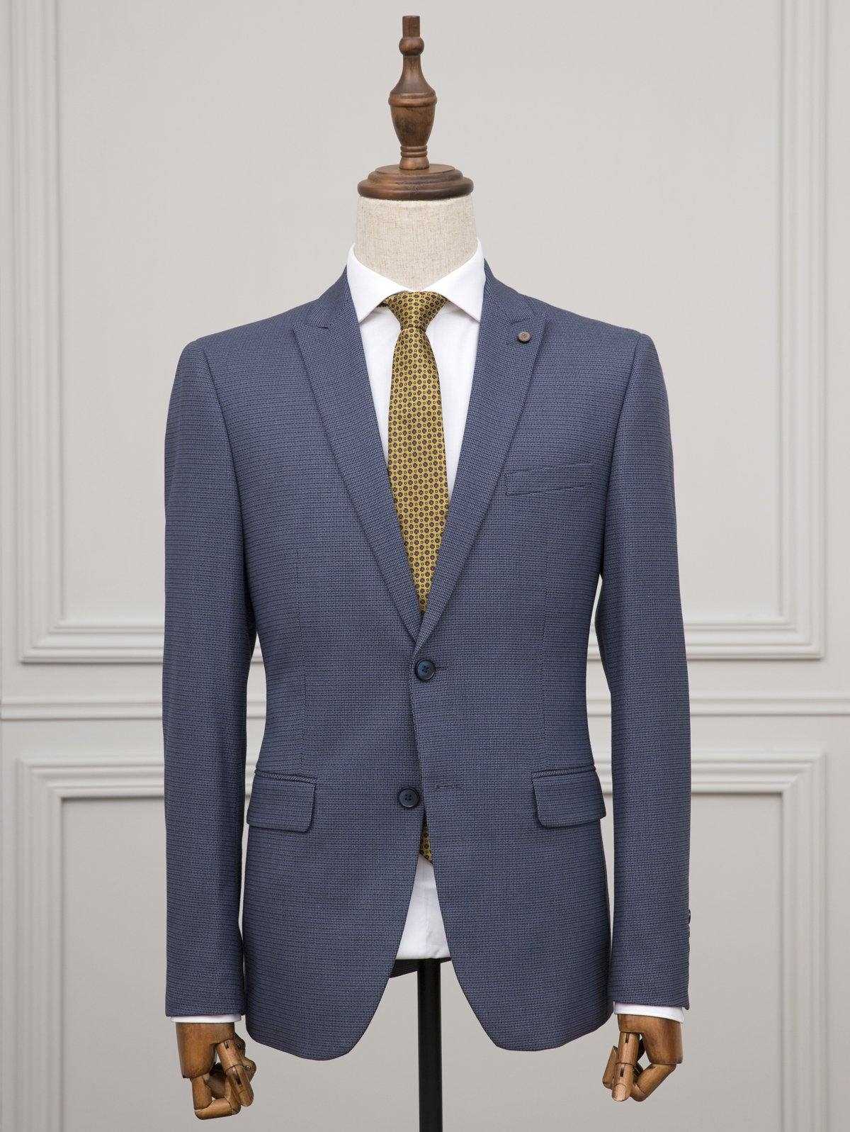 Blue two-piece suit with matching jacket and vest, paired with yellow patterned tie