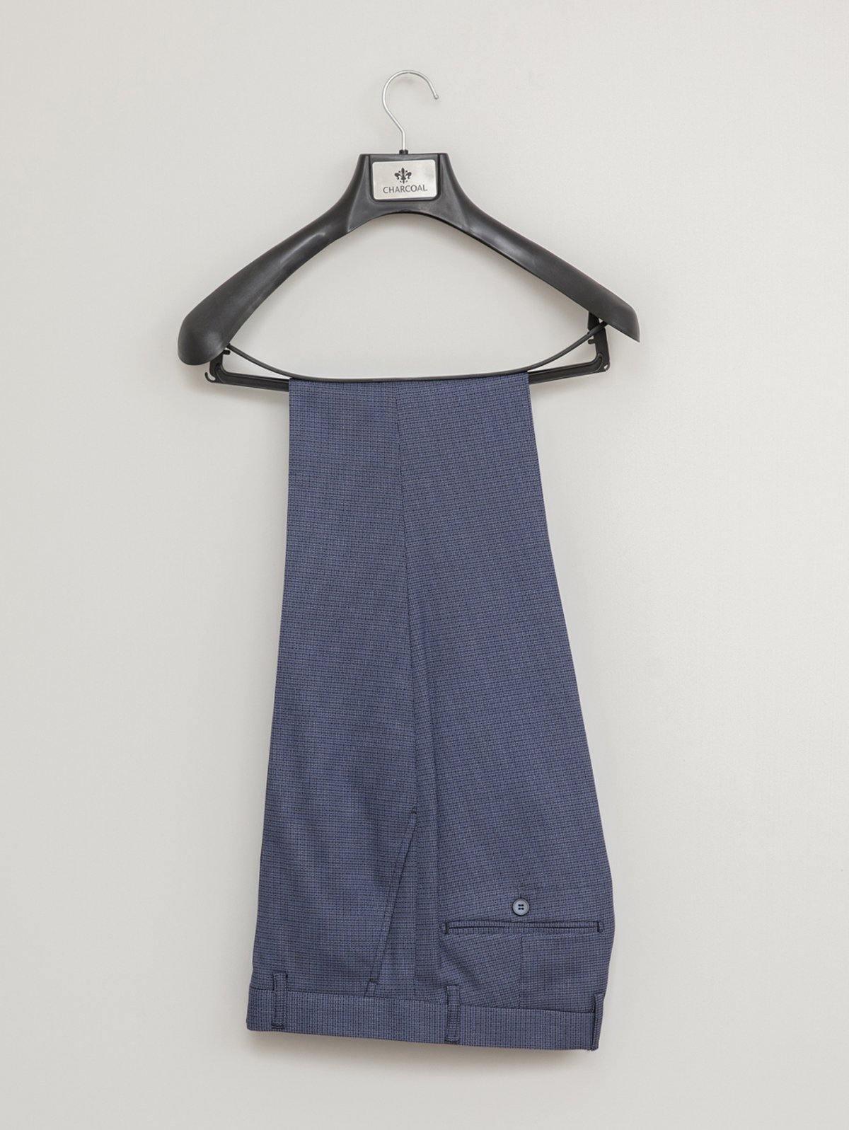 Blue suit trousers with belt loops and side button closure, hanging on a hanger