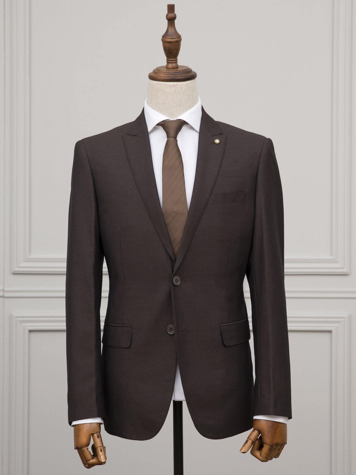 Brown suit jacket on mannequin with white shirt and striped tie