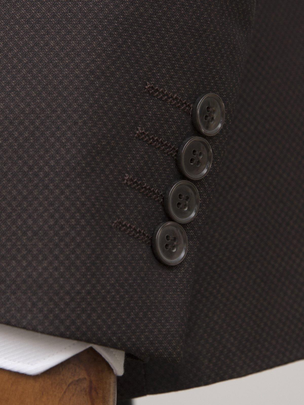 Brown suit jacket front close-up with four dark buttons