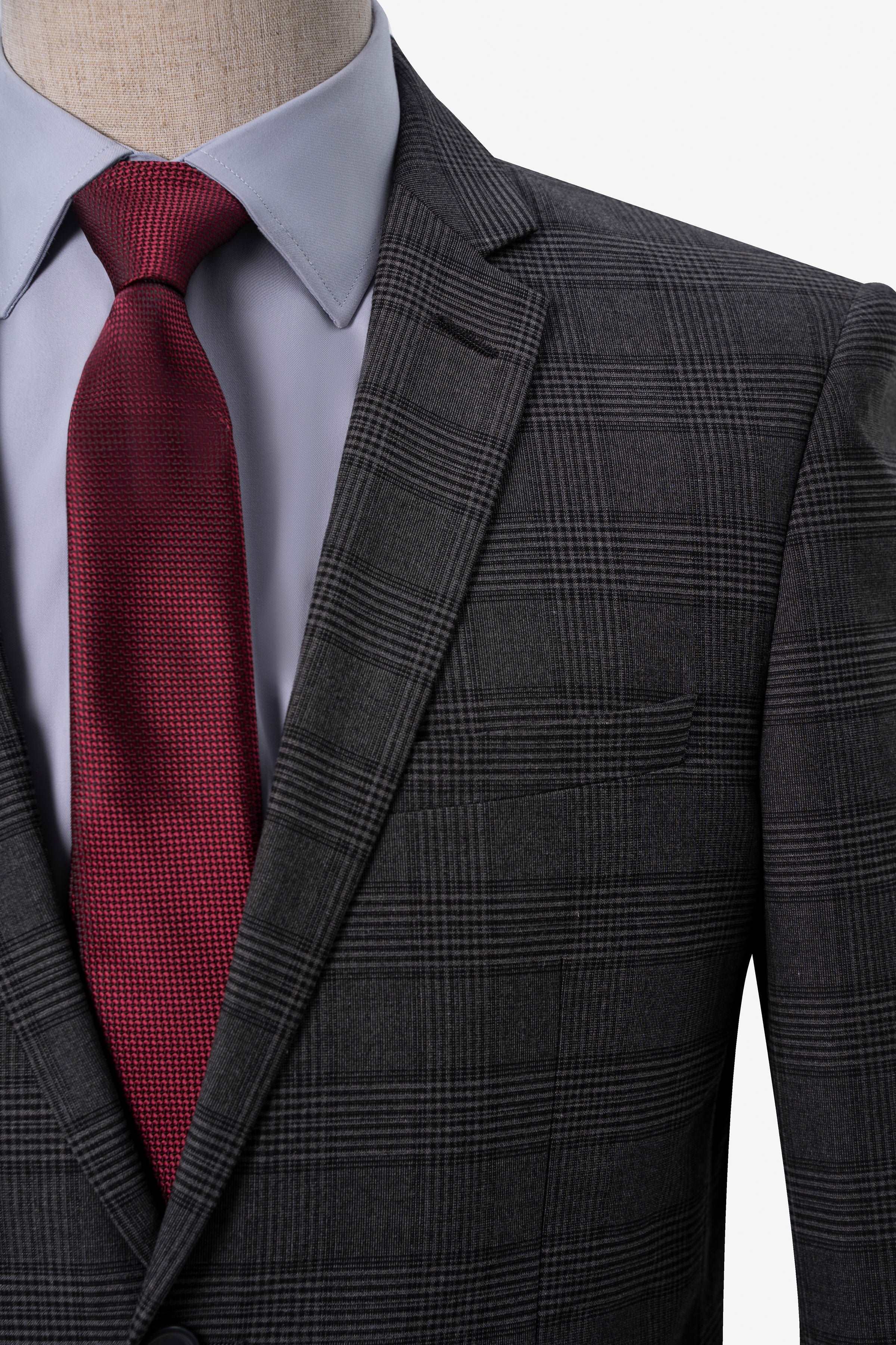 Dark grey suit jacket with notch lapels and red tie