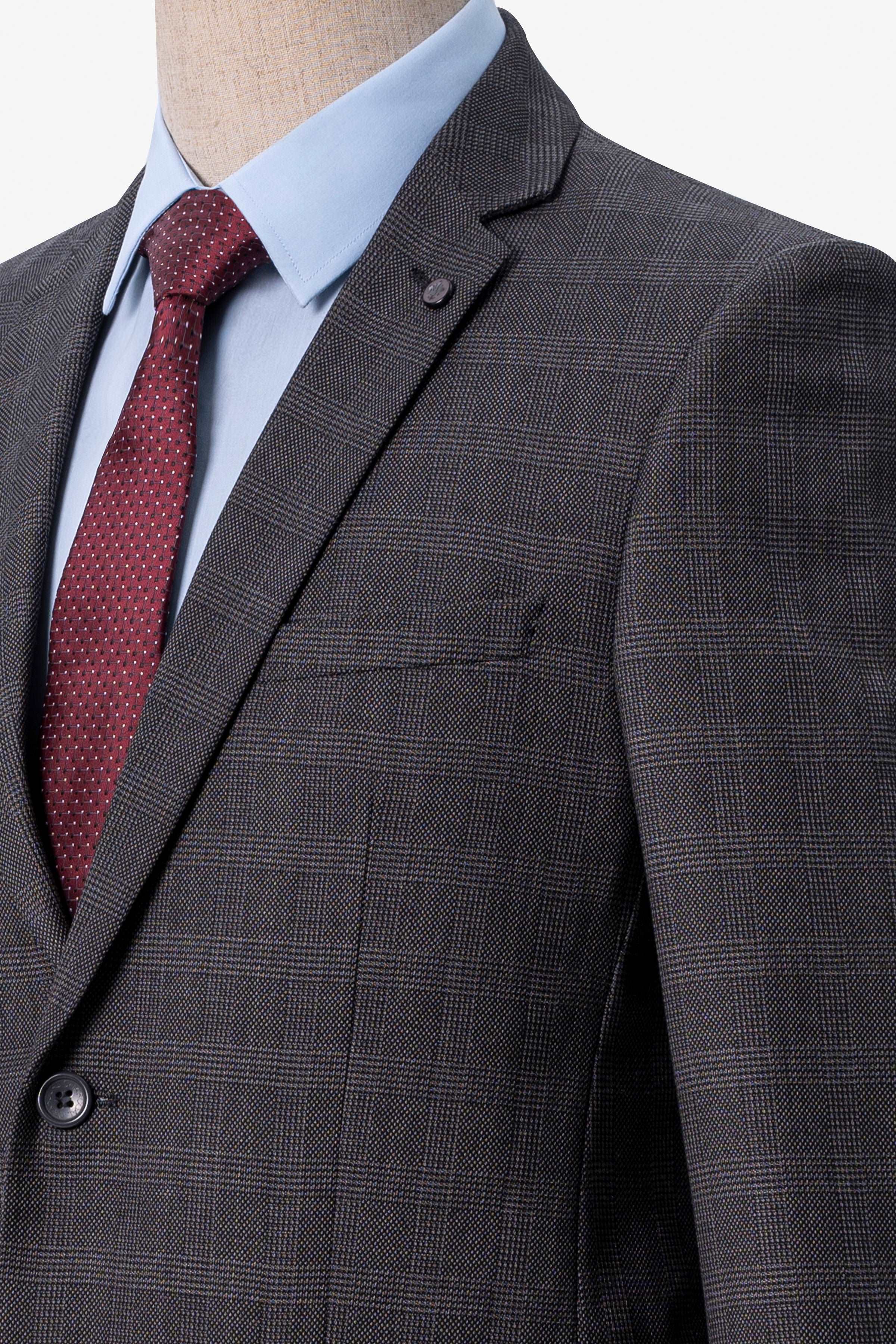 Dark grey plaid suit jacket lapel with chest pocket and dark buttons