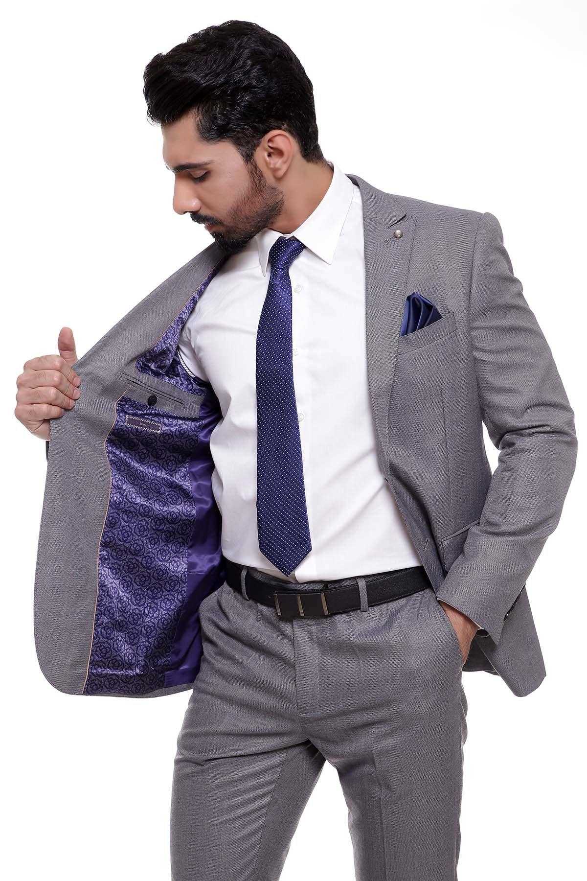 Two-piece grey suit, side view with open jacket and purple patterned lining