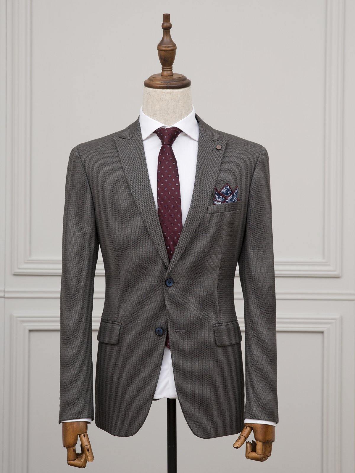 Grey two-piece suit jacket with white shirt, burgundy tie, and pocket square