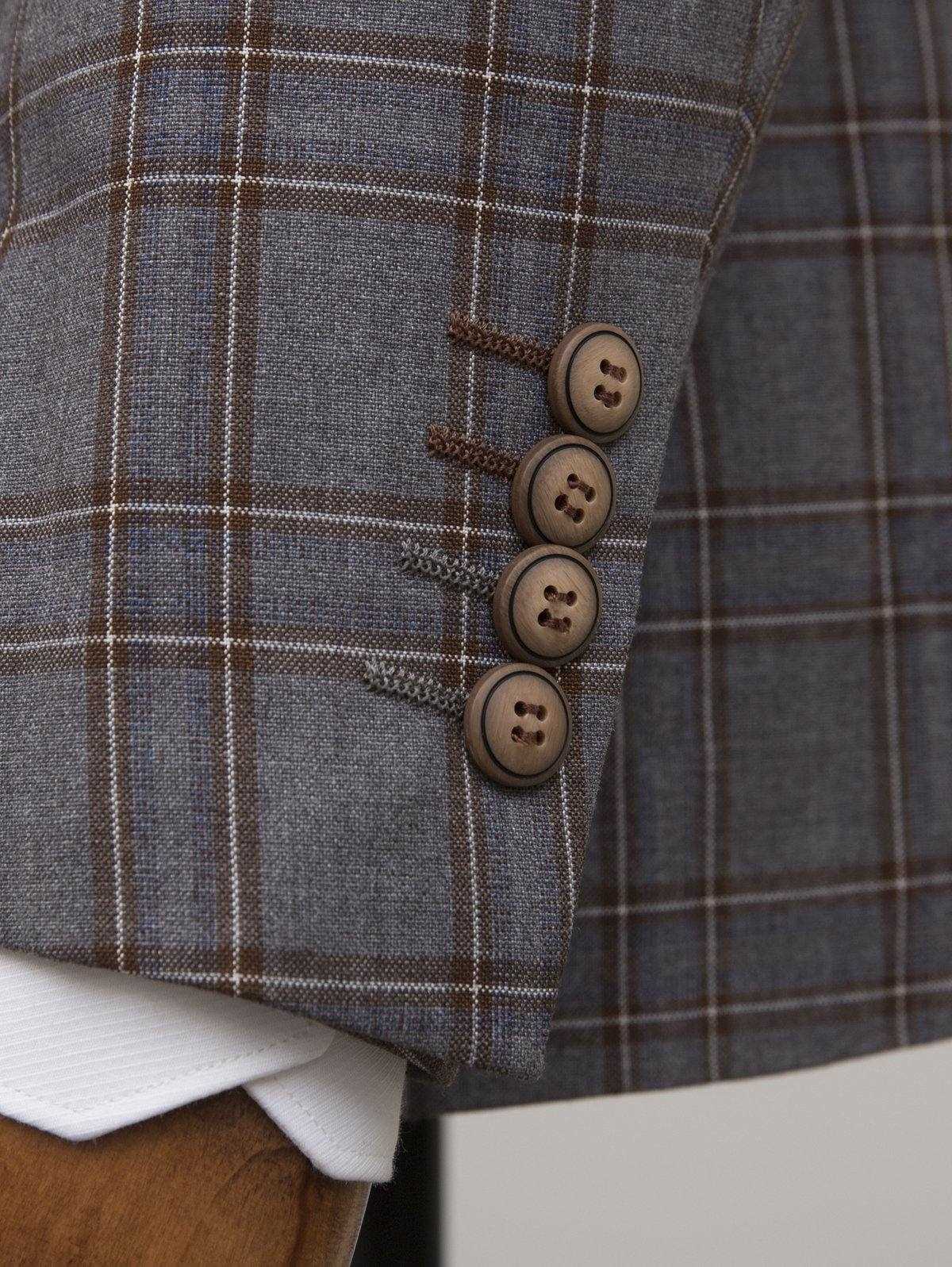Grey plaid blazer cuff with four-button closure