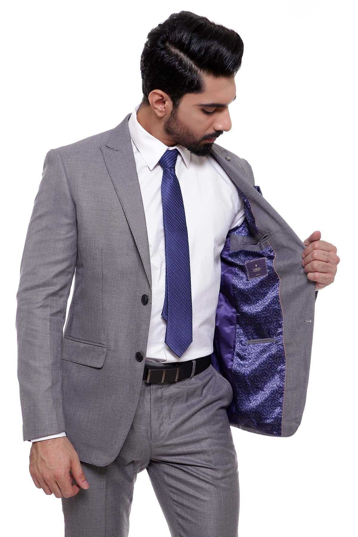 Two-piece grey suit, open jacket, white shirt, blue tie, purple lining