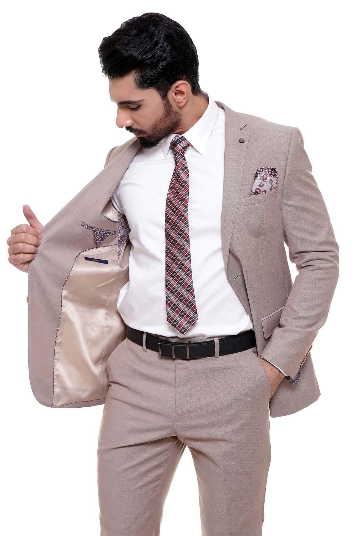 Light brown suit jacket with check tie and chest pocket, worn with belt