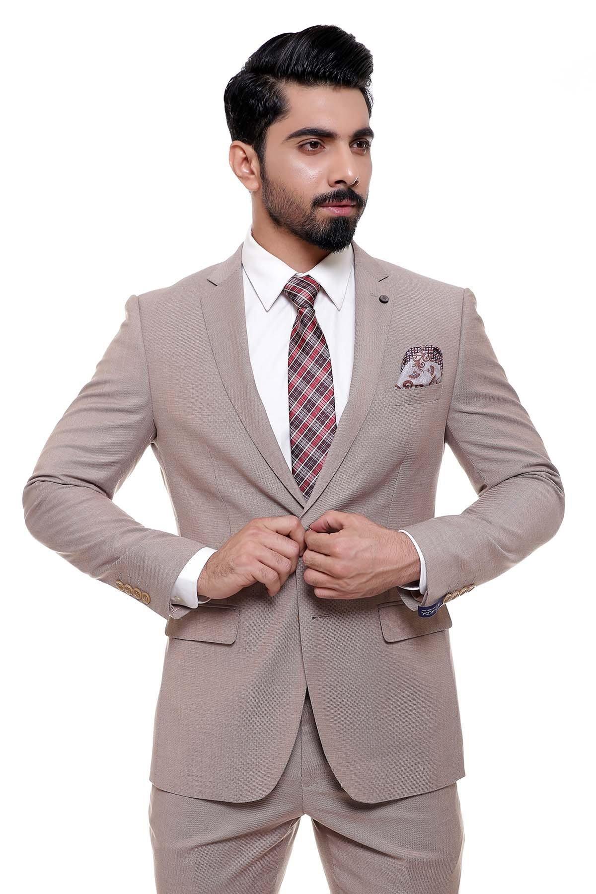 Light brown suit jacket with check-pattern tie and folded pocket square