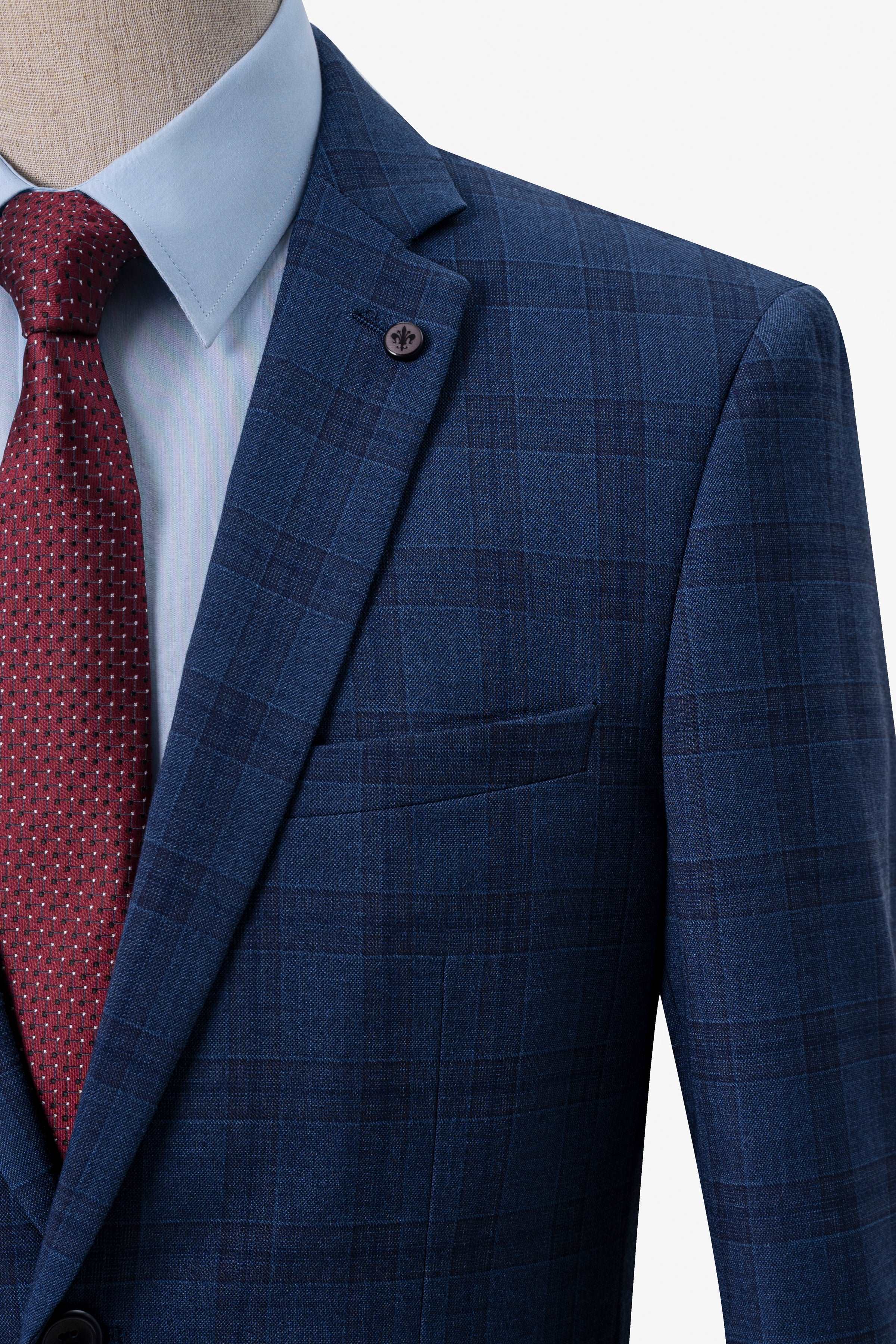 Navy blue check suit jacket with breast pocket and red patterned tie