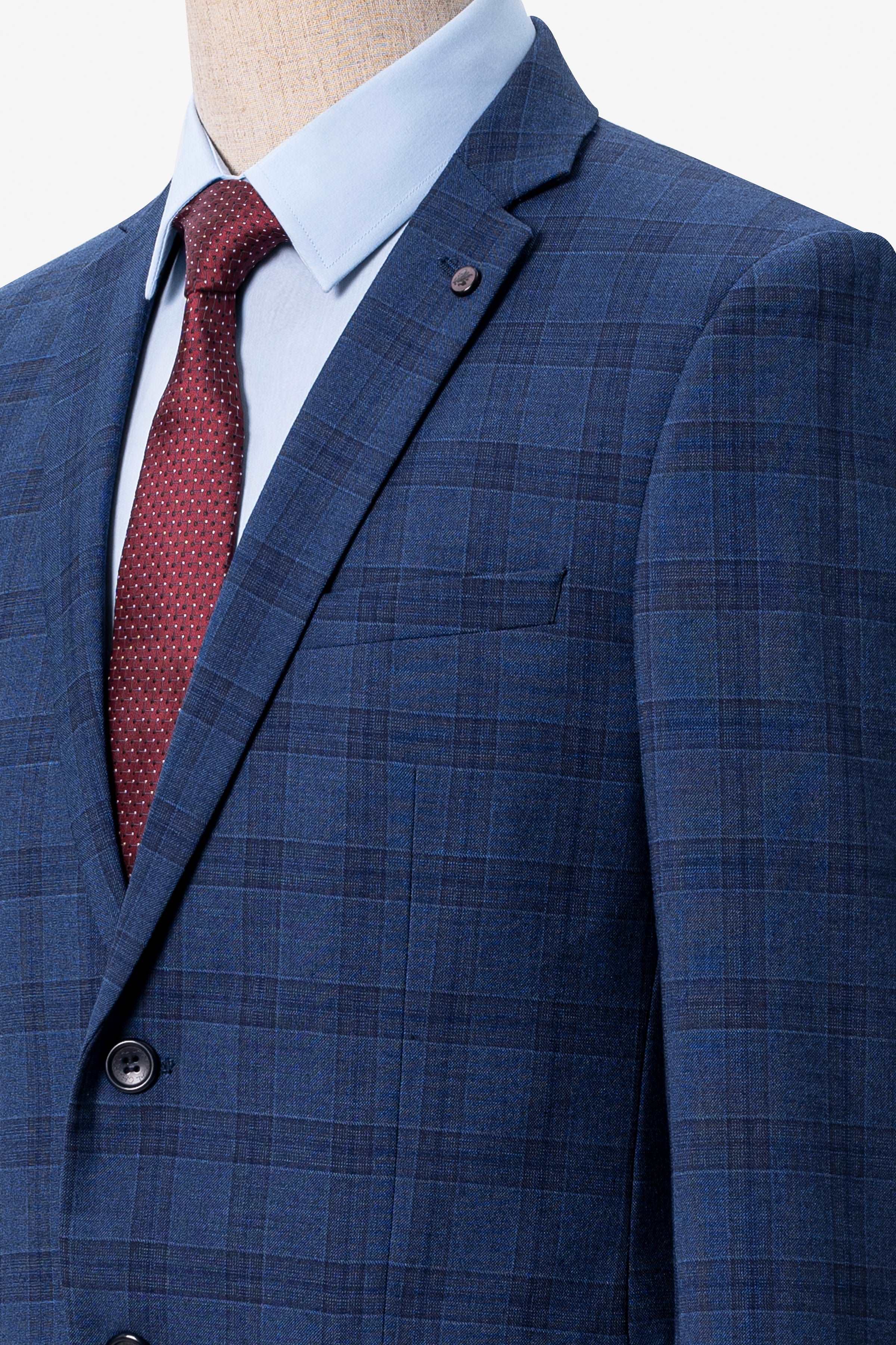 Navy blue check suit jacket lapel with welt pocket and visible red tie