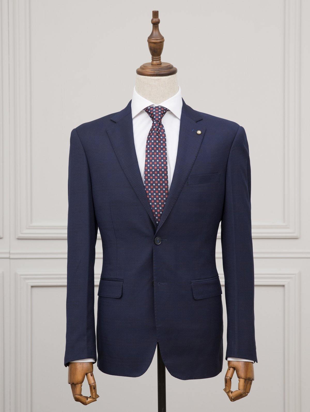 Navy blue suit jacket, two-button front and welt pockets