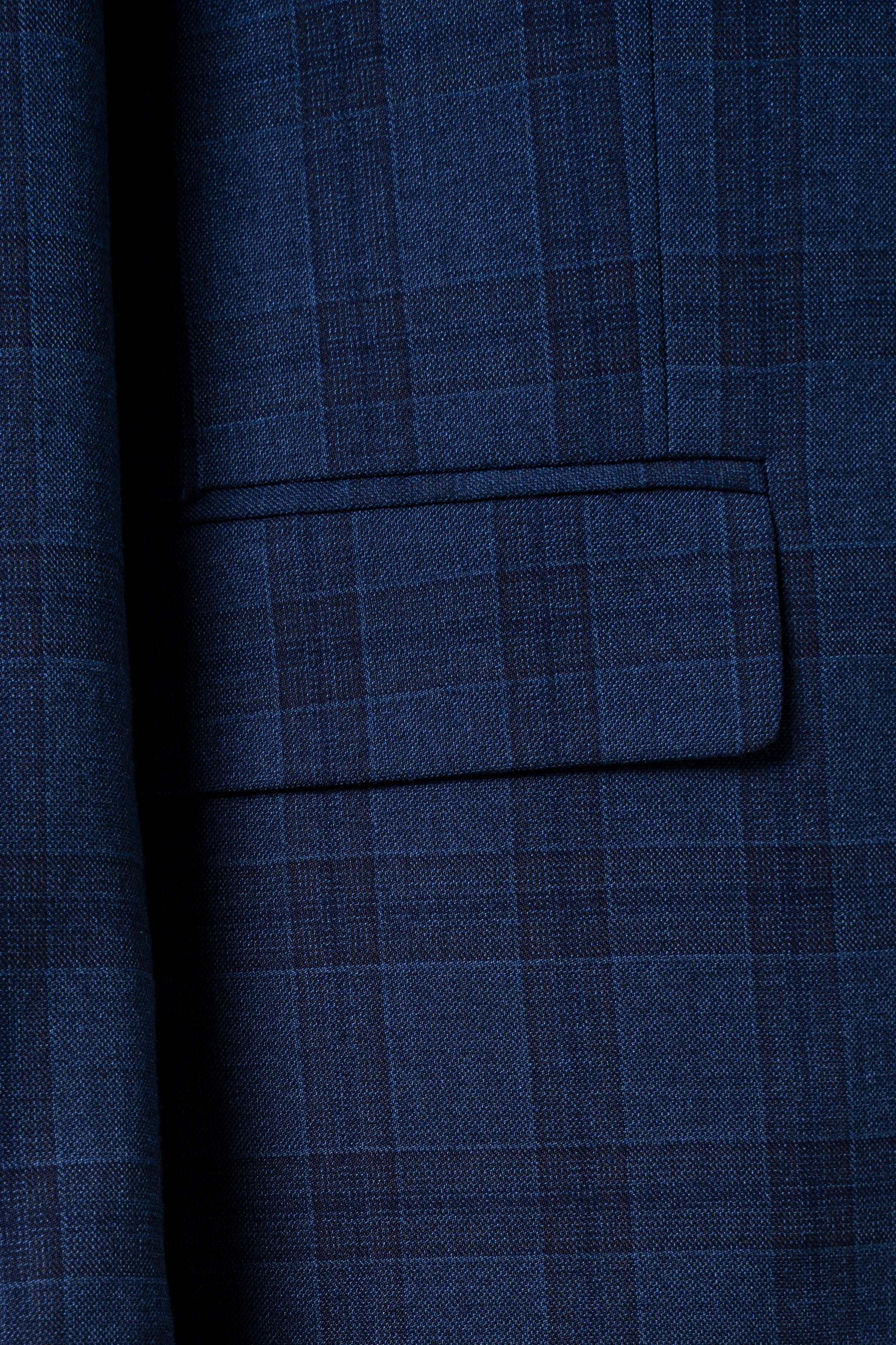 Navy blue check suit jacket flap pocket detail