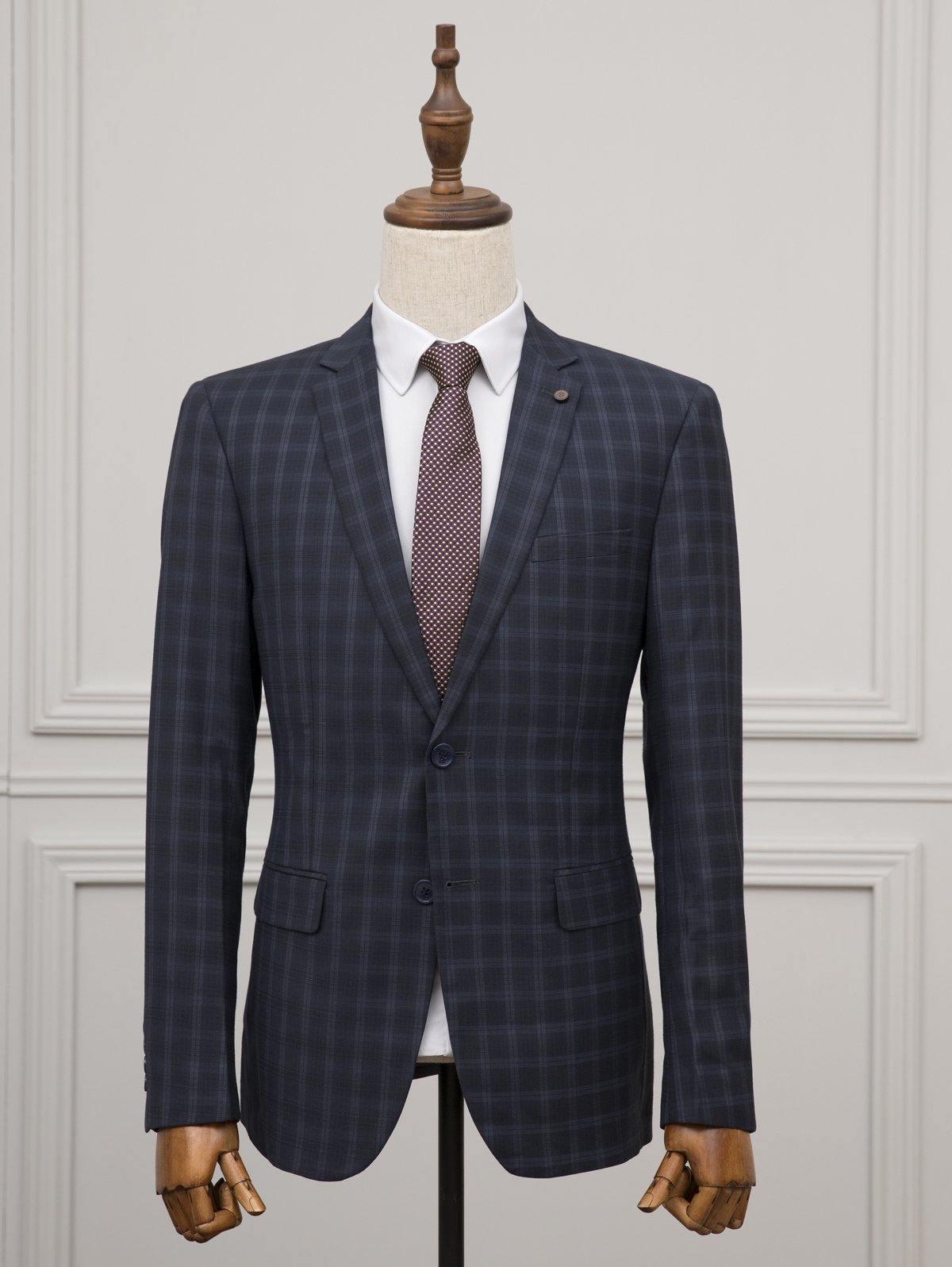 Navy plaid two-piece suit with matching jacket and trousers on a mannequin
