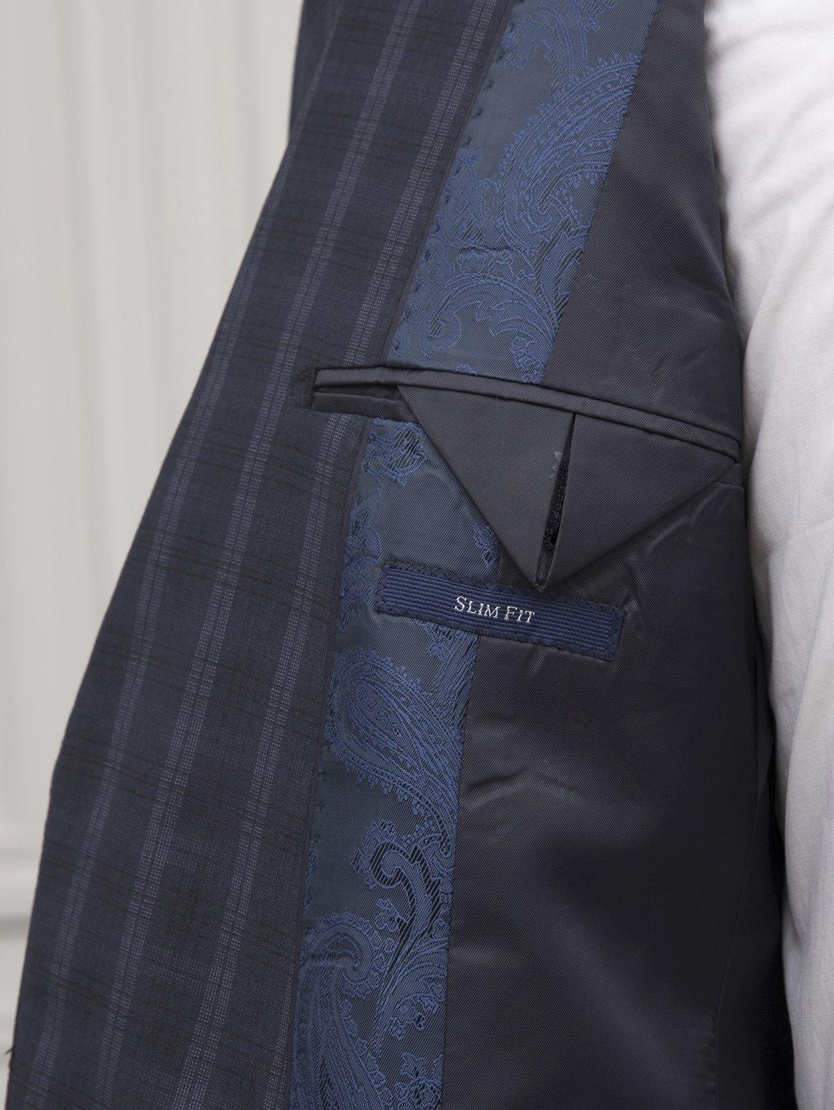 Navy plaid suit jacket with pocket detail and “SLIM FIT” label
