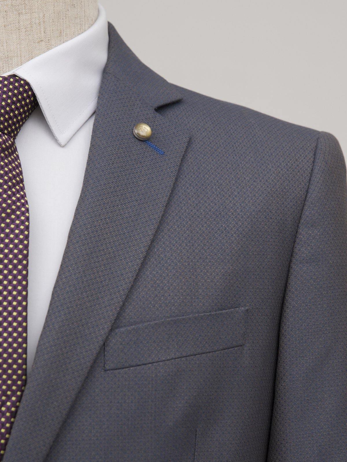 Navy suit blazer with gold button detail and breast pocket