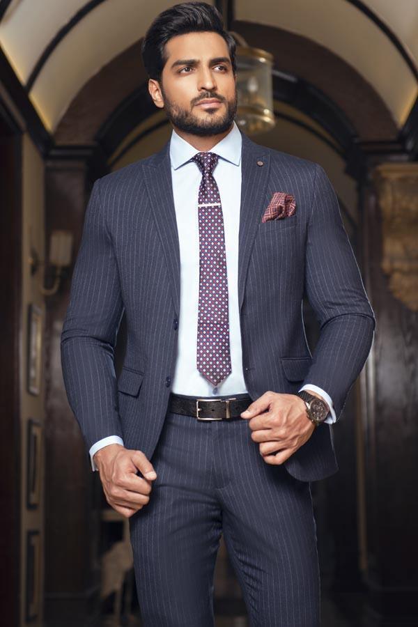 Navy 2-piece suit with pinstripe blazer and trousers, white shirt, purple patterned tie