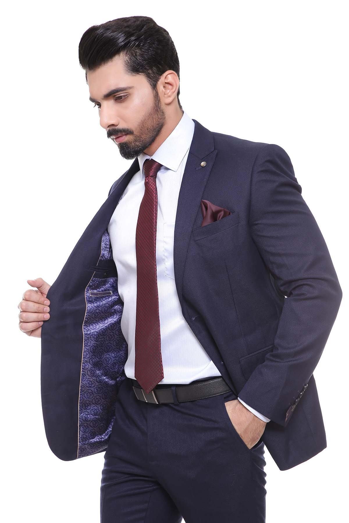 Dark navy two-piece suit with blazer, trousers, burgundy tie; blue patterned inner lining.
