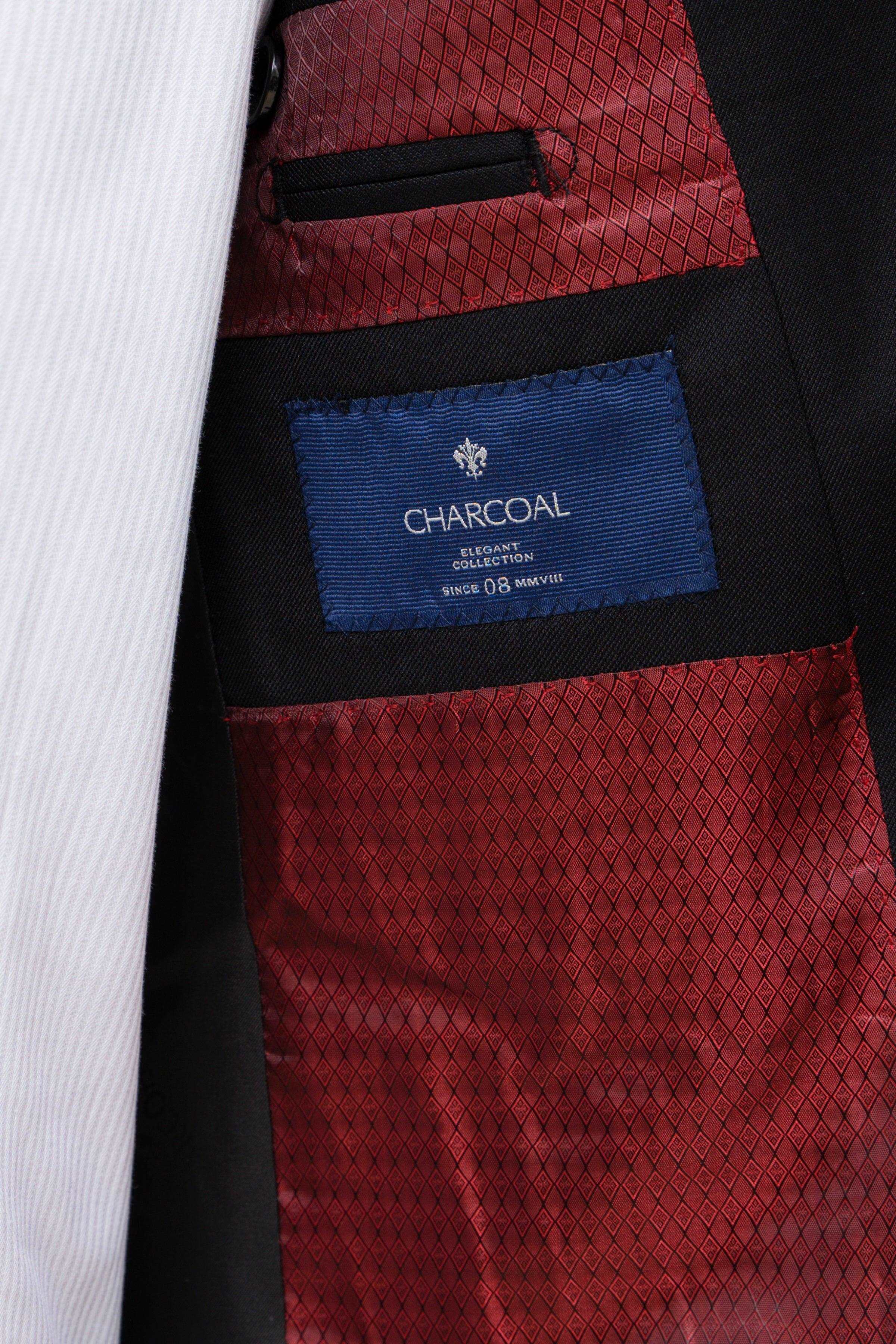 Suit jacket interior pocket lining with Charcoal label and red patterned fabric
