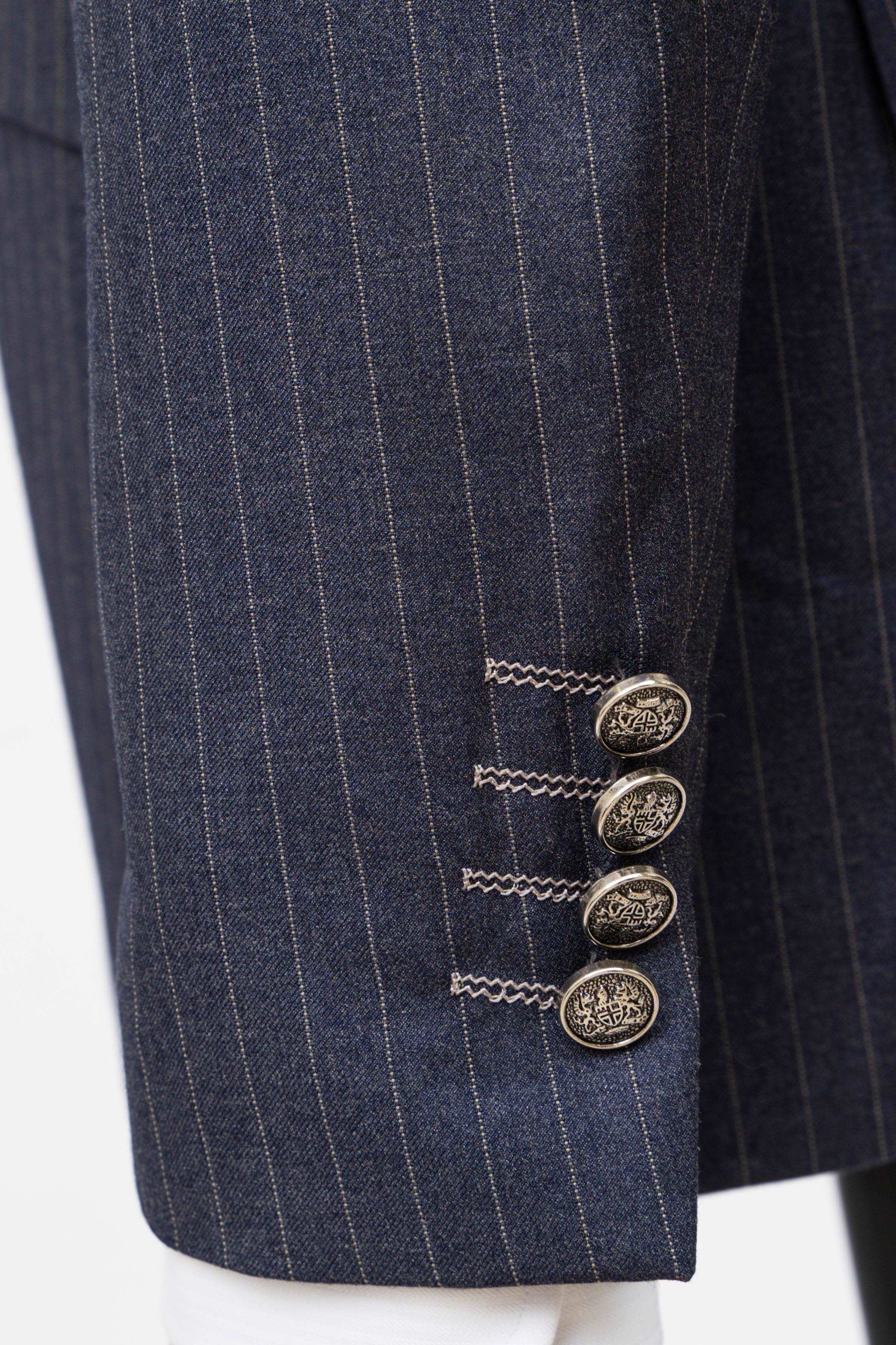 Double-breasted pinstripe suit jacket button detail, navy gray fabric