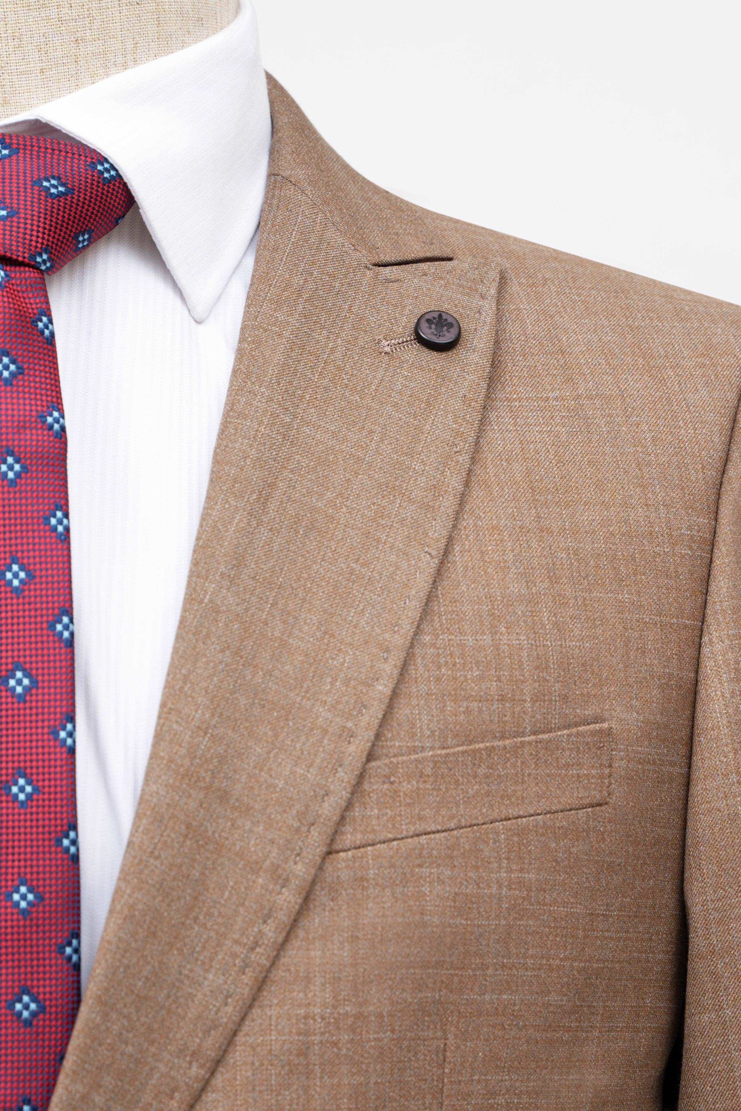 Light brown suit jacket close-up with buttoned lapel and chest pocket