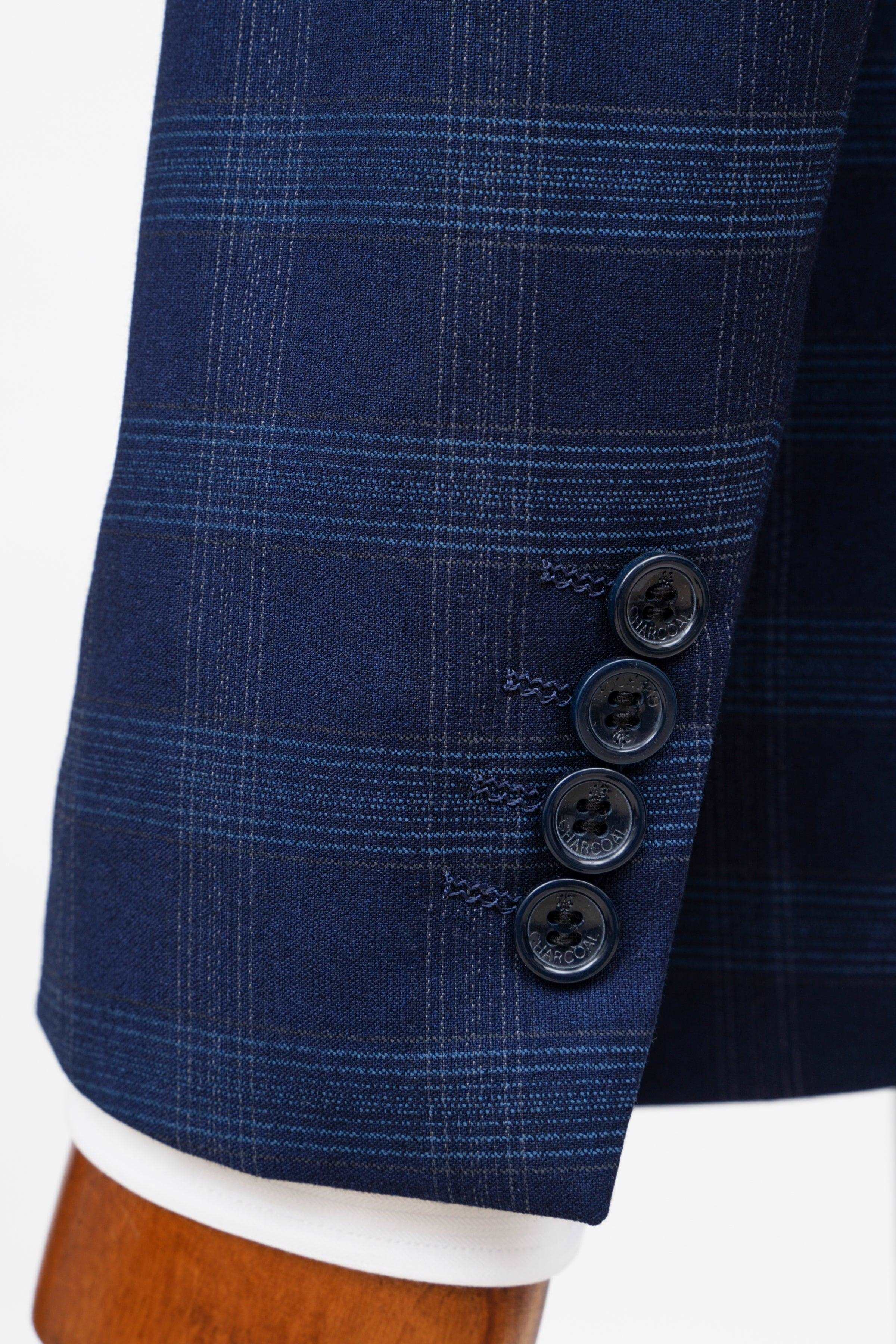 Navy check suit jacket sleeve cuff with four dark buttons