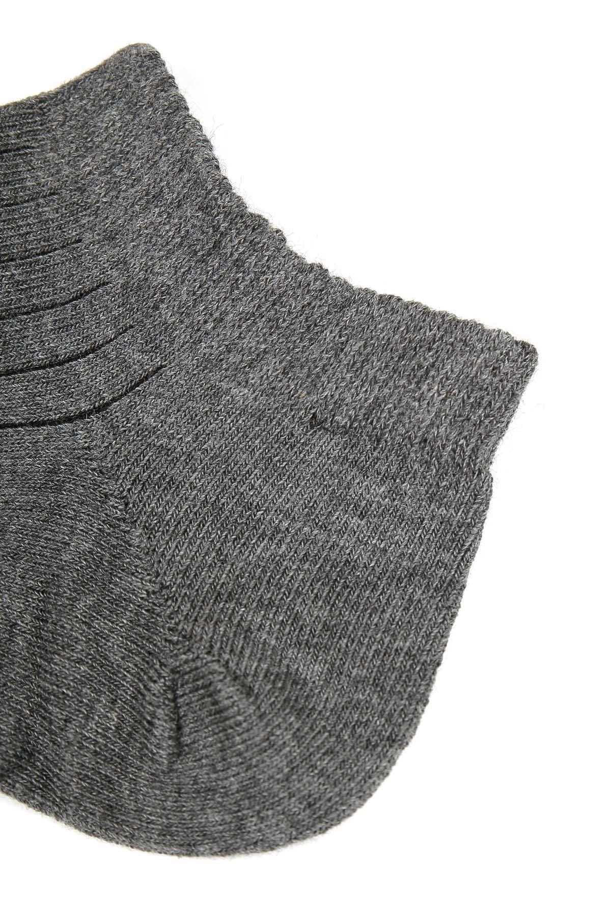 Dark gray ankle sock close-up with ribbed toe and arch stitching