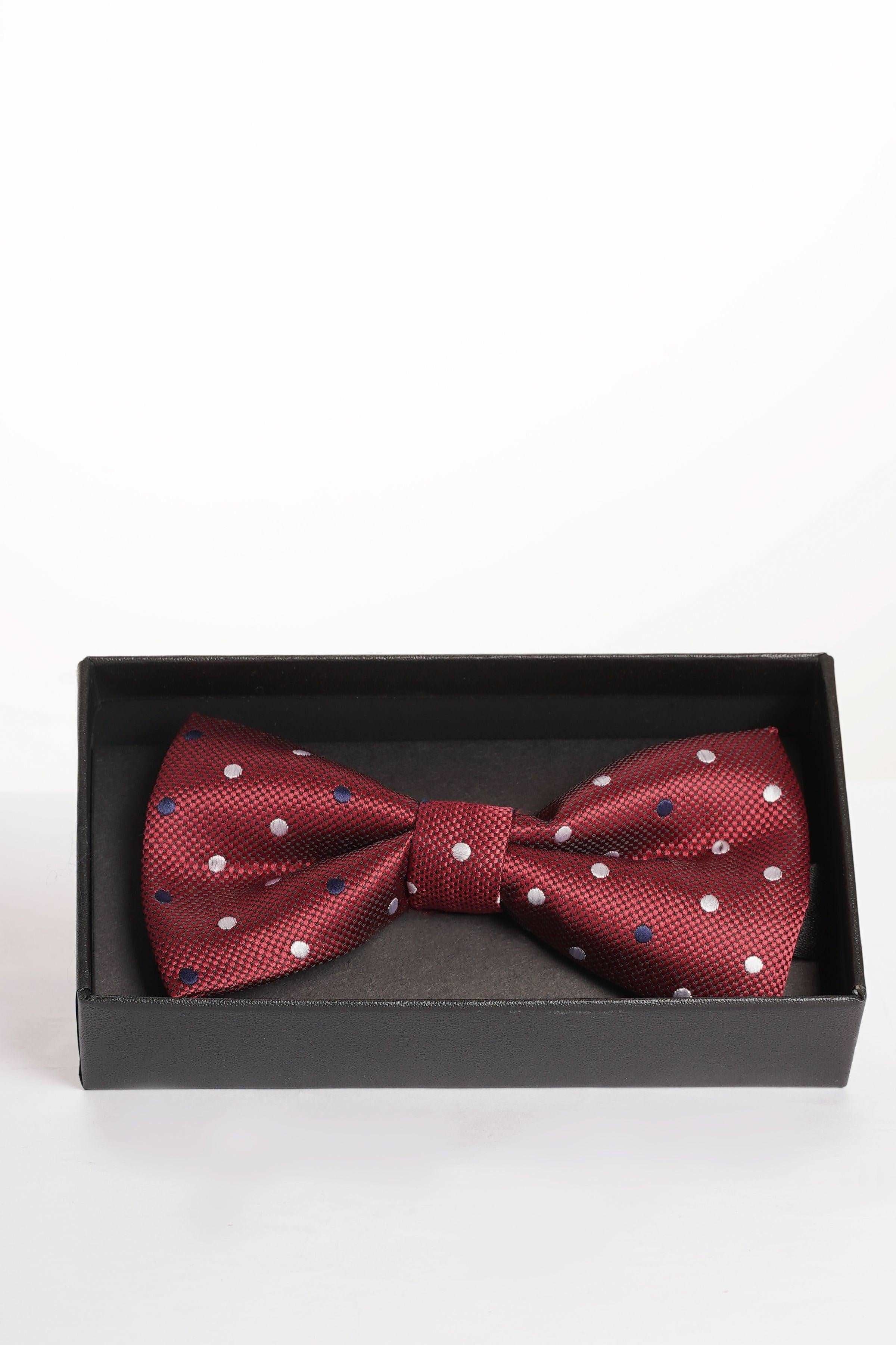 Red bow tie with white polka dots and blue speckled accents