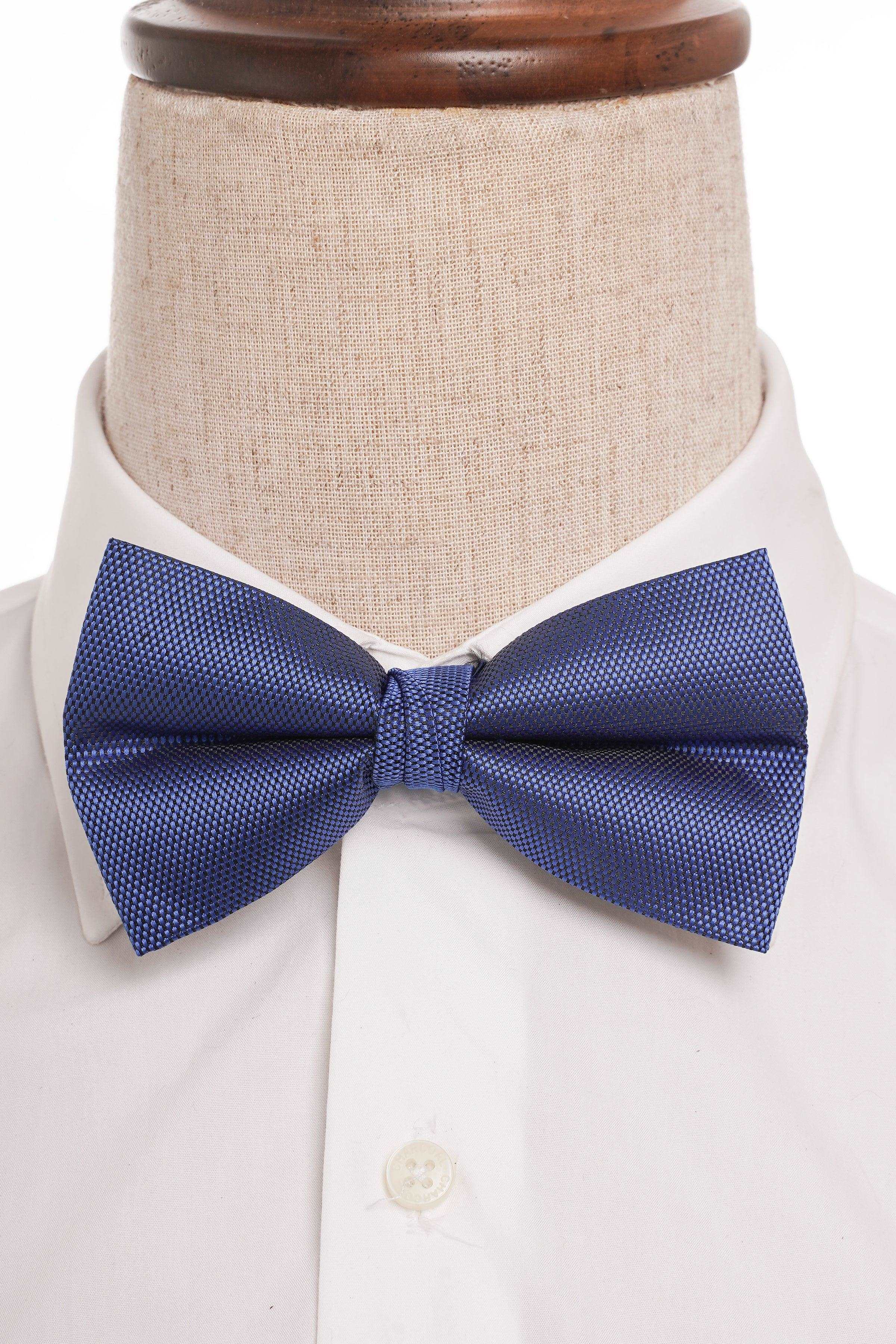 Blue bow tie on white dress shirt collar