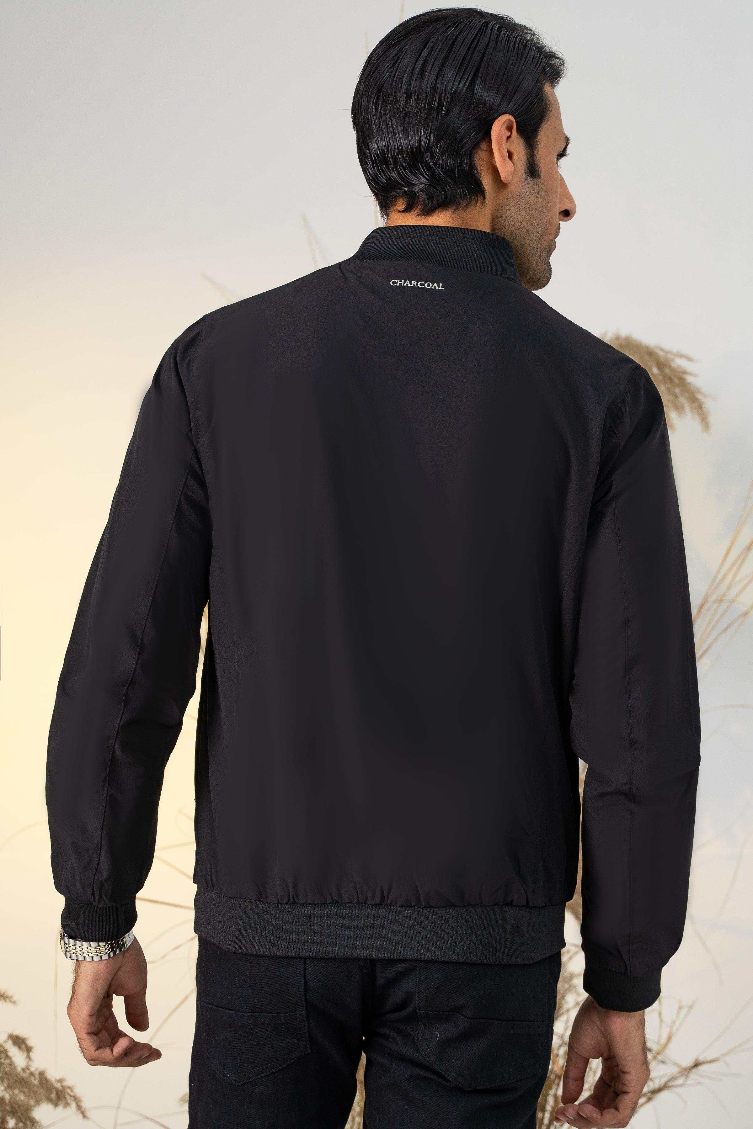 Black windbreaker jacket back view with elastic cuffs and hem