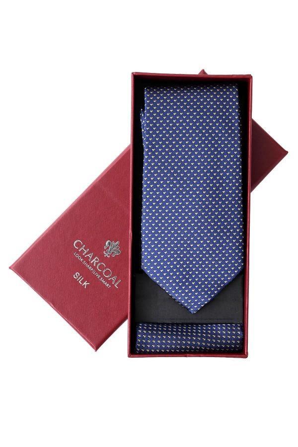 Navy patterned silk tie in gift box with maroon cover