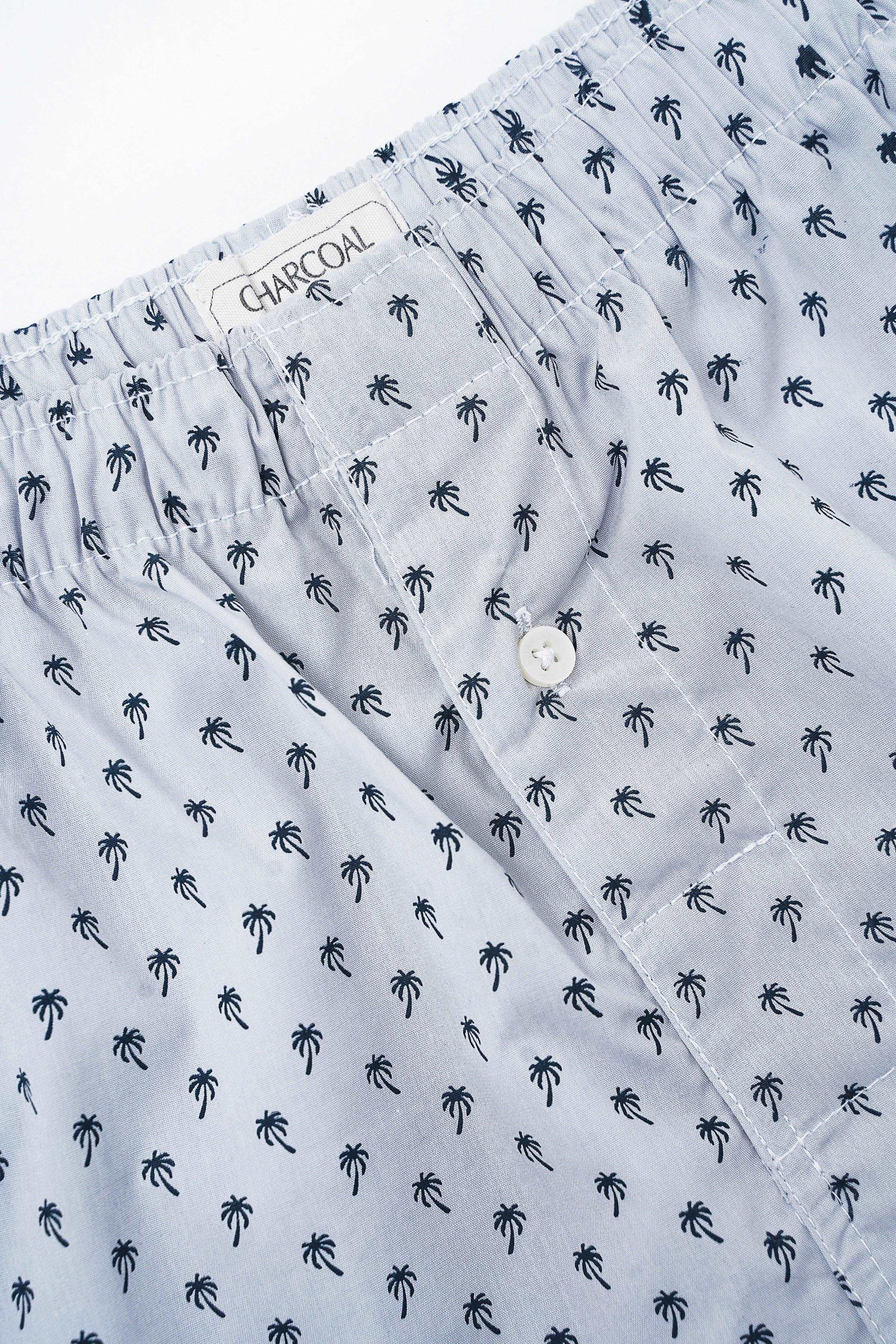 Boxer shorts fabric close-up with repeated palm tree print