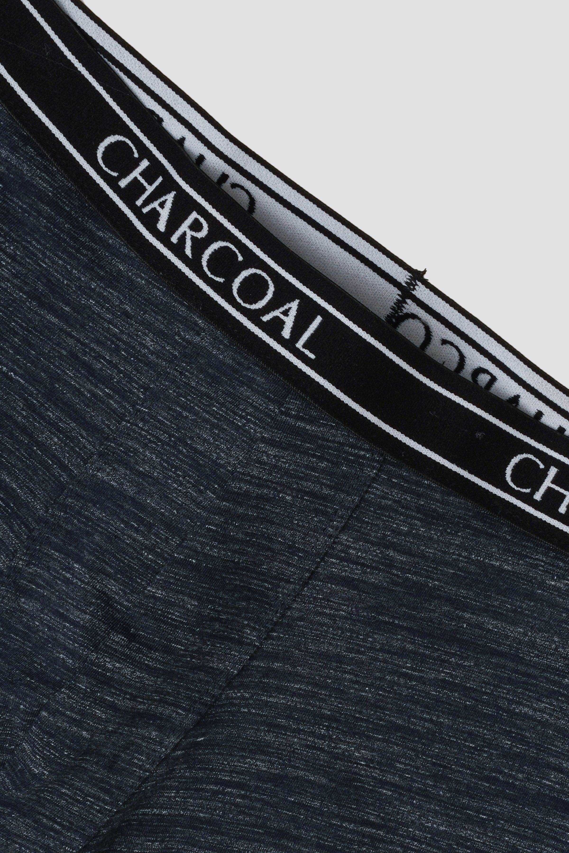 Knitted boxer waistband detail with CHARCOAL logo on dark blue fabric