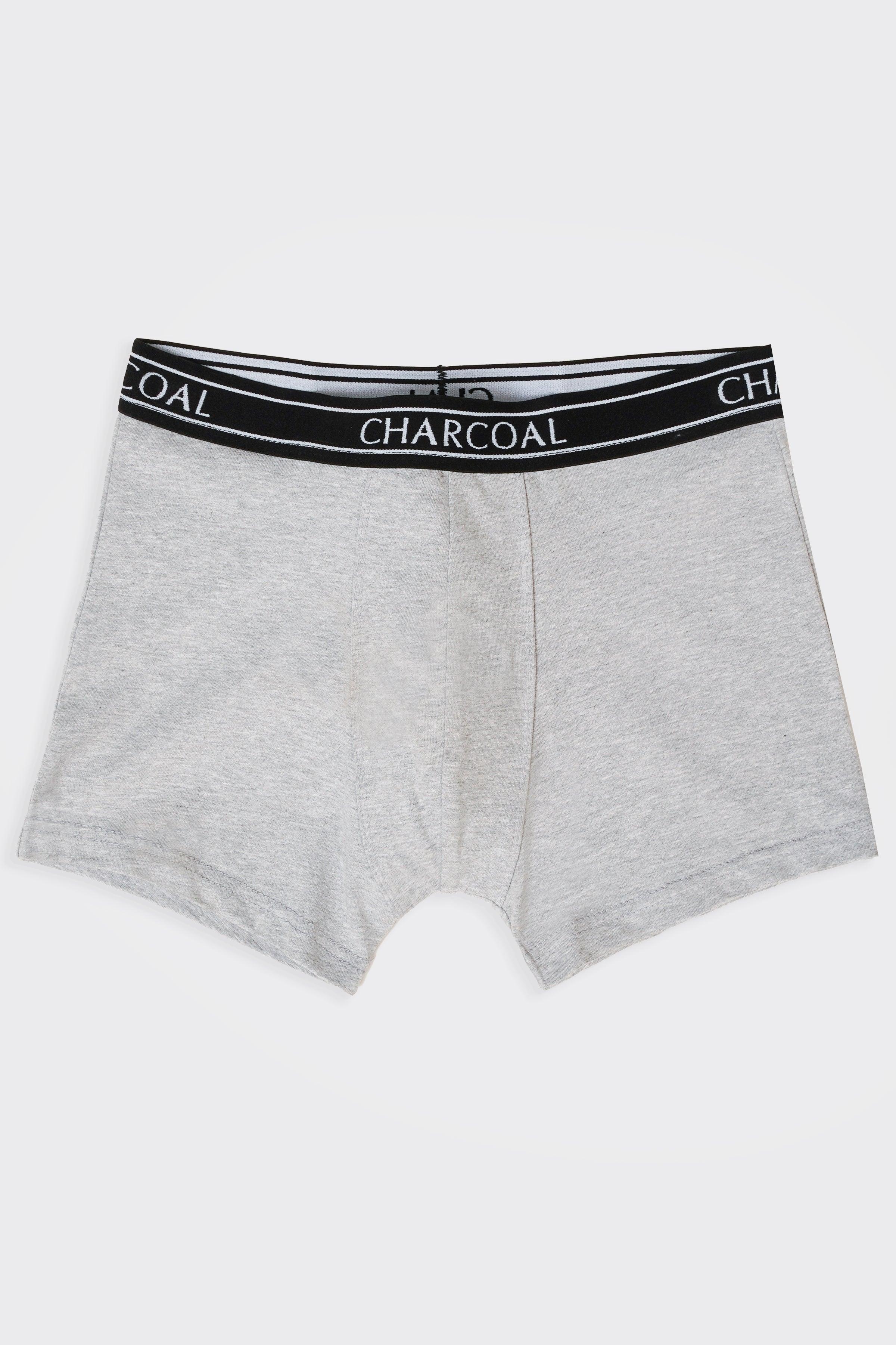 Grey knitted boxer shorts with black waistband and charcoal text logo