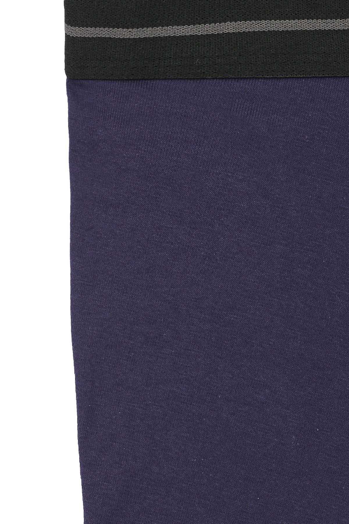 Navy blue boxer shorts fabric close-up with dark ribbed waistband strip.