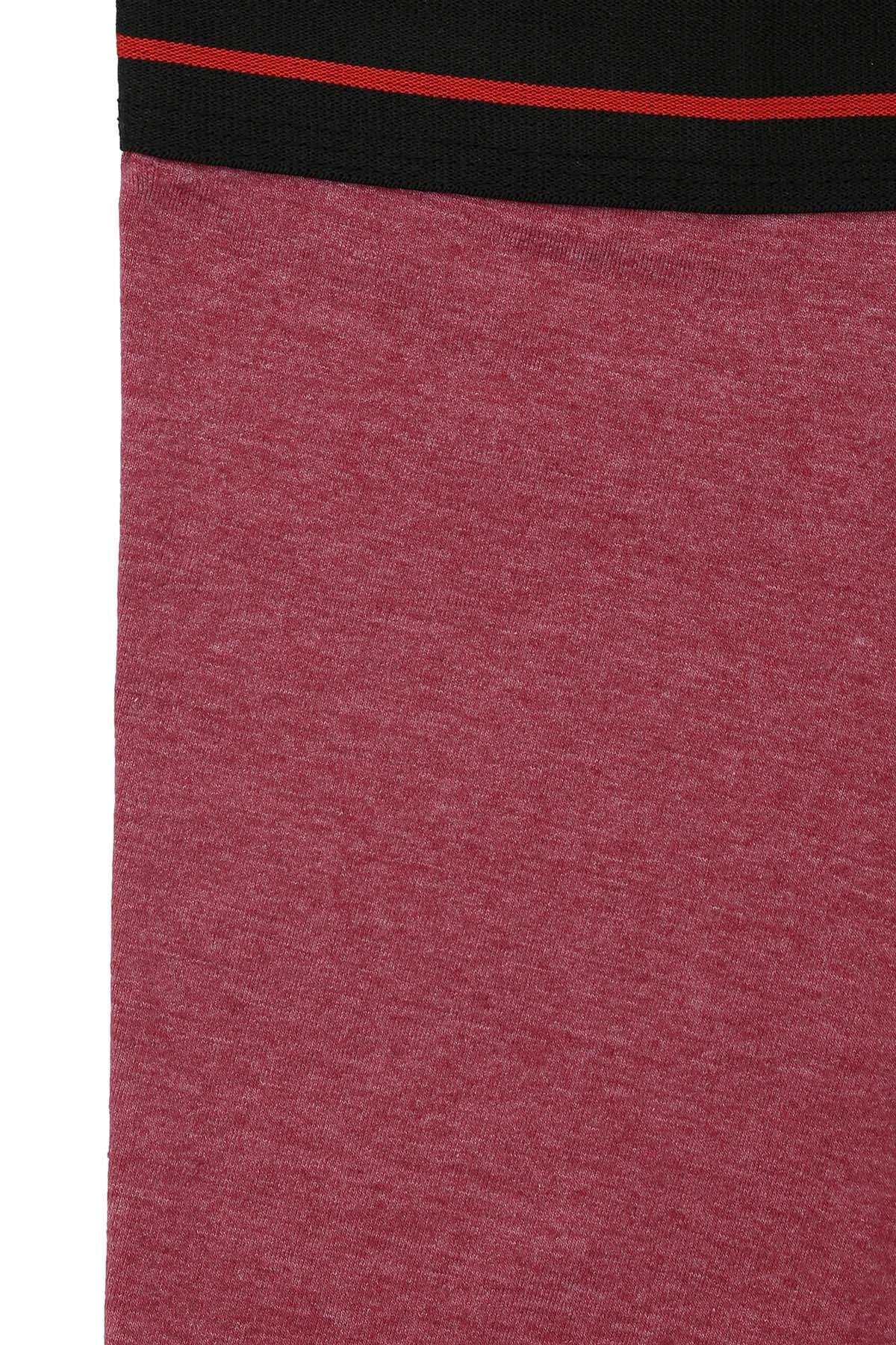 Plum boxer shorts fabric close-up with black waistband and red stripe.