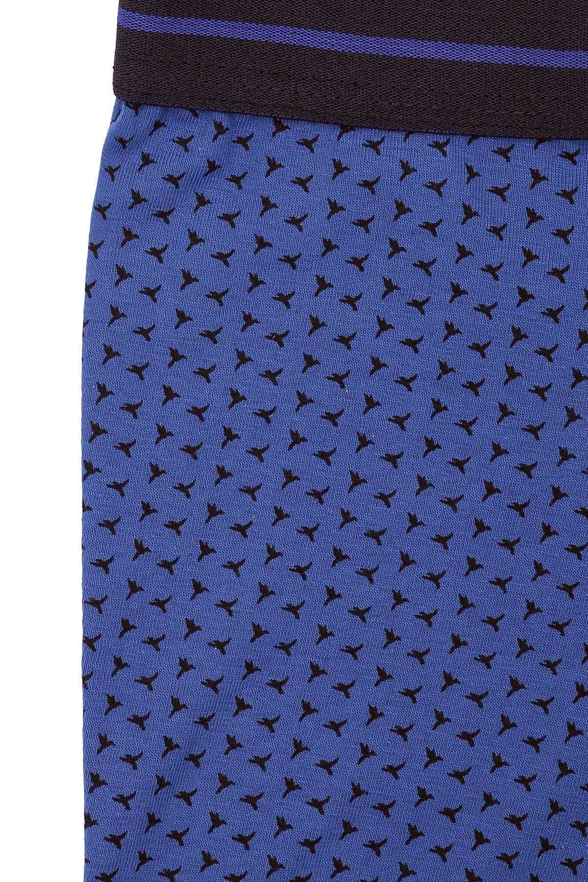 Close-up of royal blue boxer shorts with small bird pattern
