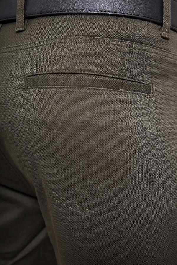 Slim-fit five-pocket pants in dark green, close-up of front pocket and stitching