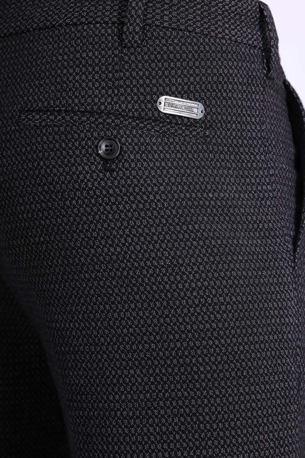 Black textured dress pants fabric with button and logo patch