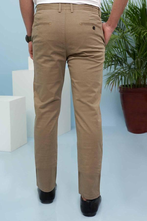Light brown cross pocket pants with tapered legs and button fly