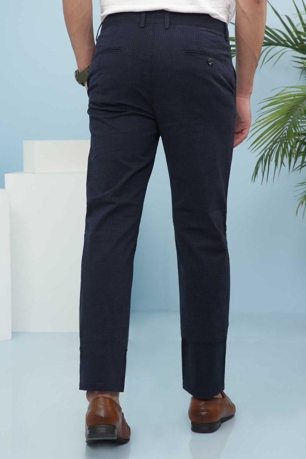Navy tailored pants with belt loops, button closure, and straight tapered fit