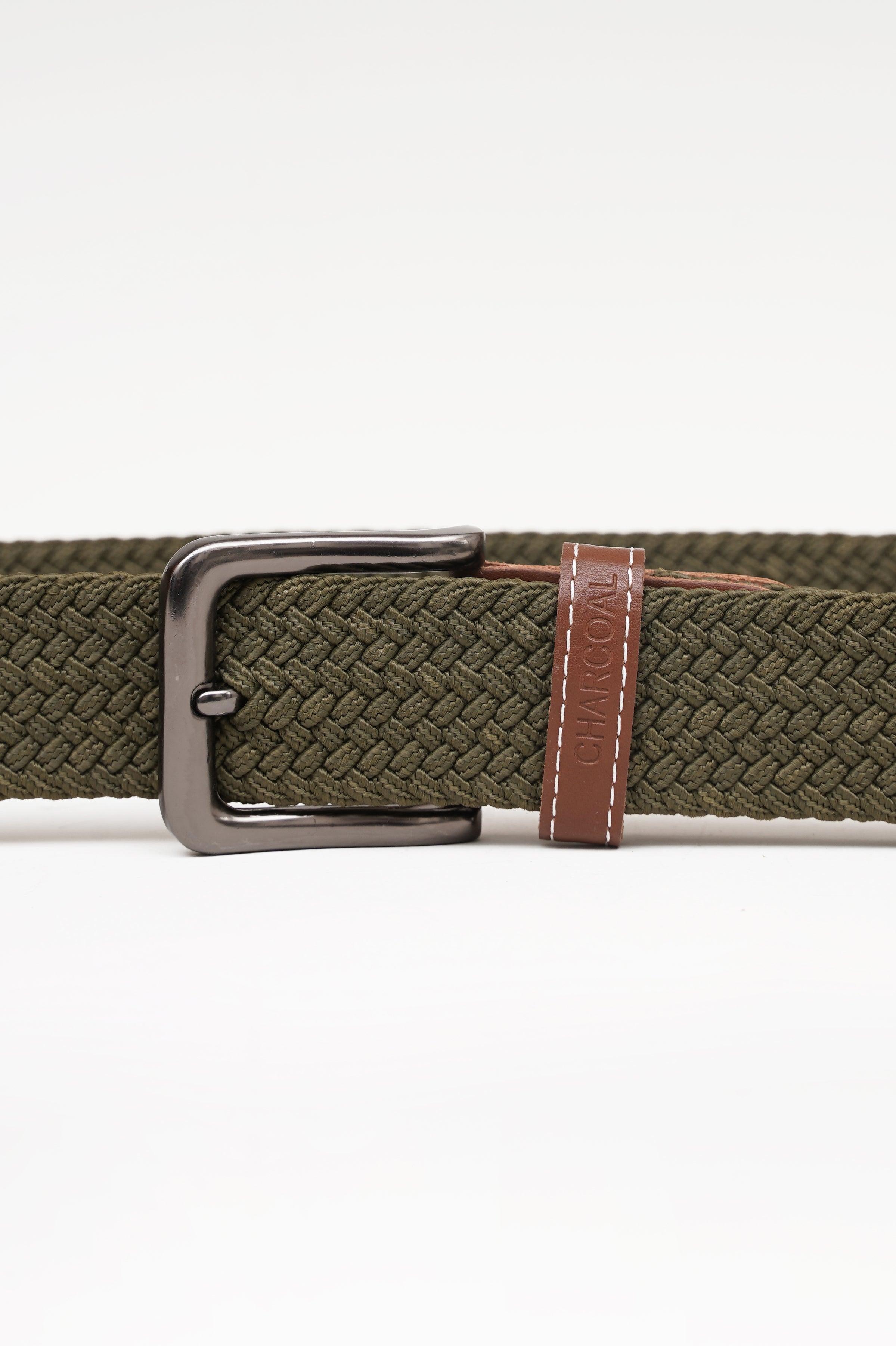 Olive woven belt with silver buckle and brown leather keeper strap detail