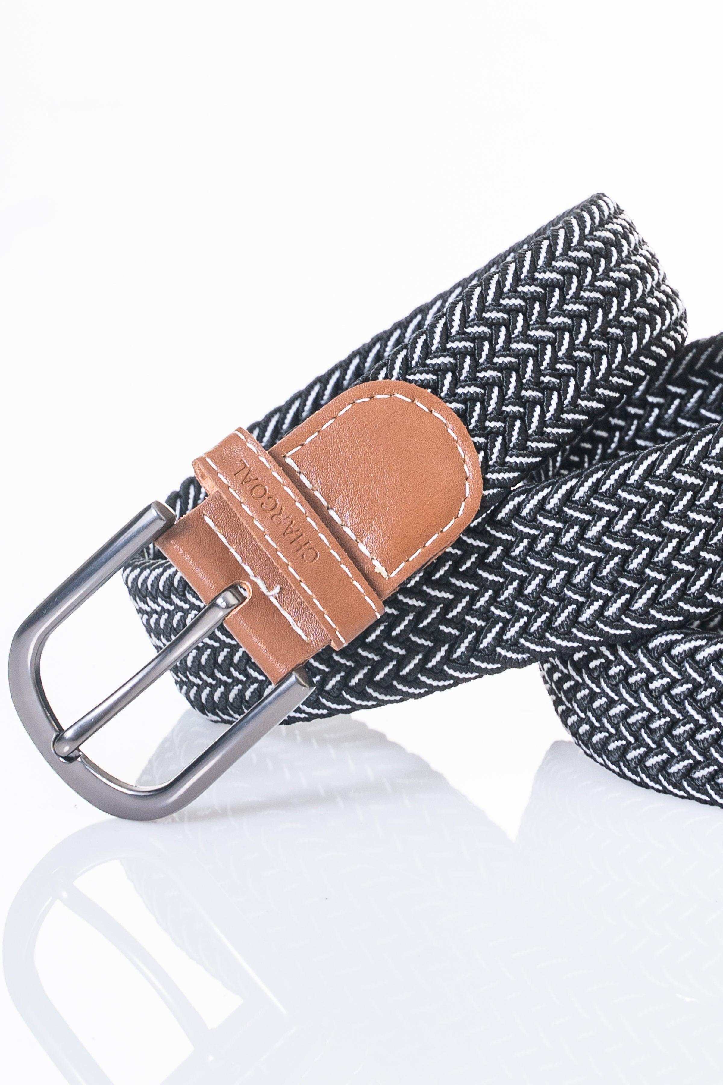Textured woven belt with tan leather keeper and silver prong buckle.